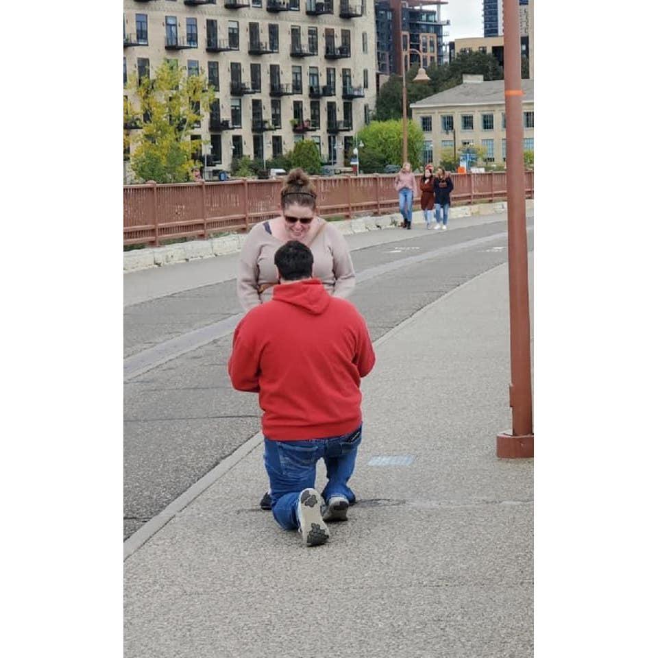 Jarod proposed after he had to chase me across the bridge in Minneapolis.