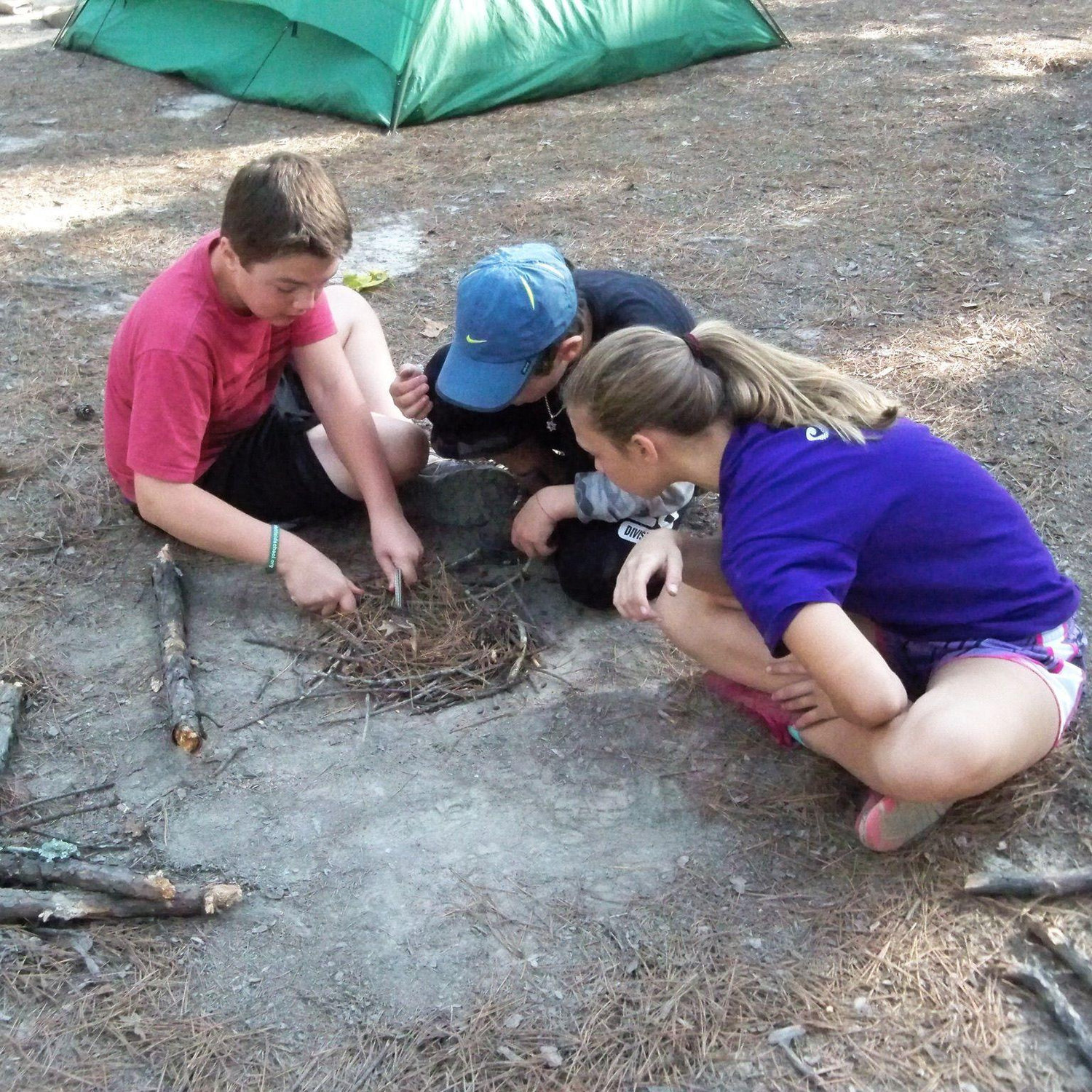 Adam & Madi building a fire together!