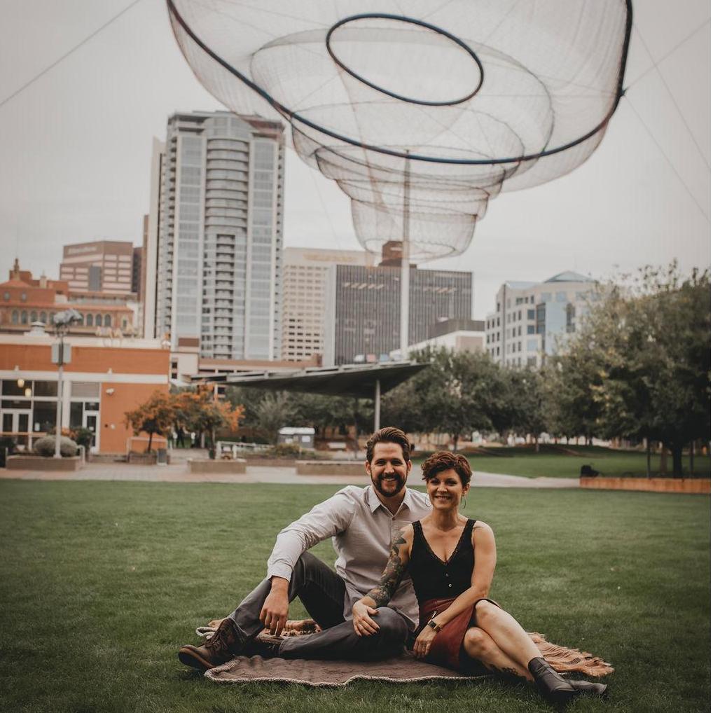 Engagement pictures in Civic Space Park on a rare rainy day. This photographer is also our wedding photographer.