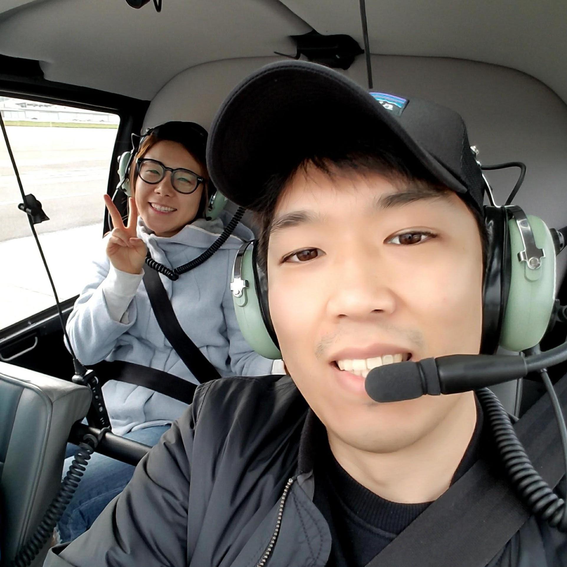 James got a gift from Stephanie to fly a helicopter around Seattle for his 29th birthday. Stephanie is just a happy observer.
