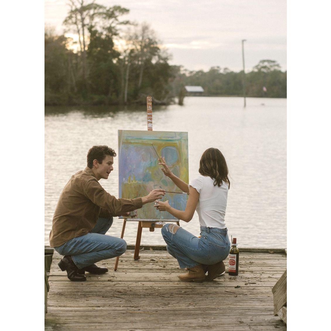 Colette thought she was mainly going to get art pictures taken of her at her favorite place (a doc in Magnolia Springs), but after looking at the sunset, Colette turned around to Hunter on one knee!