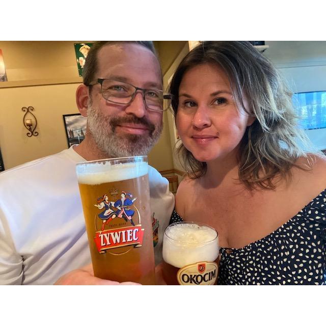 Two Polish kids at a Polish Market enjoying Polish beers and buying a ton of pierogi.