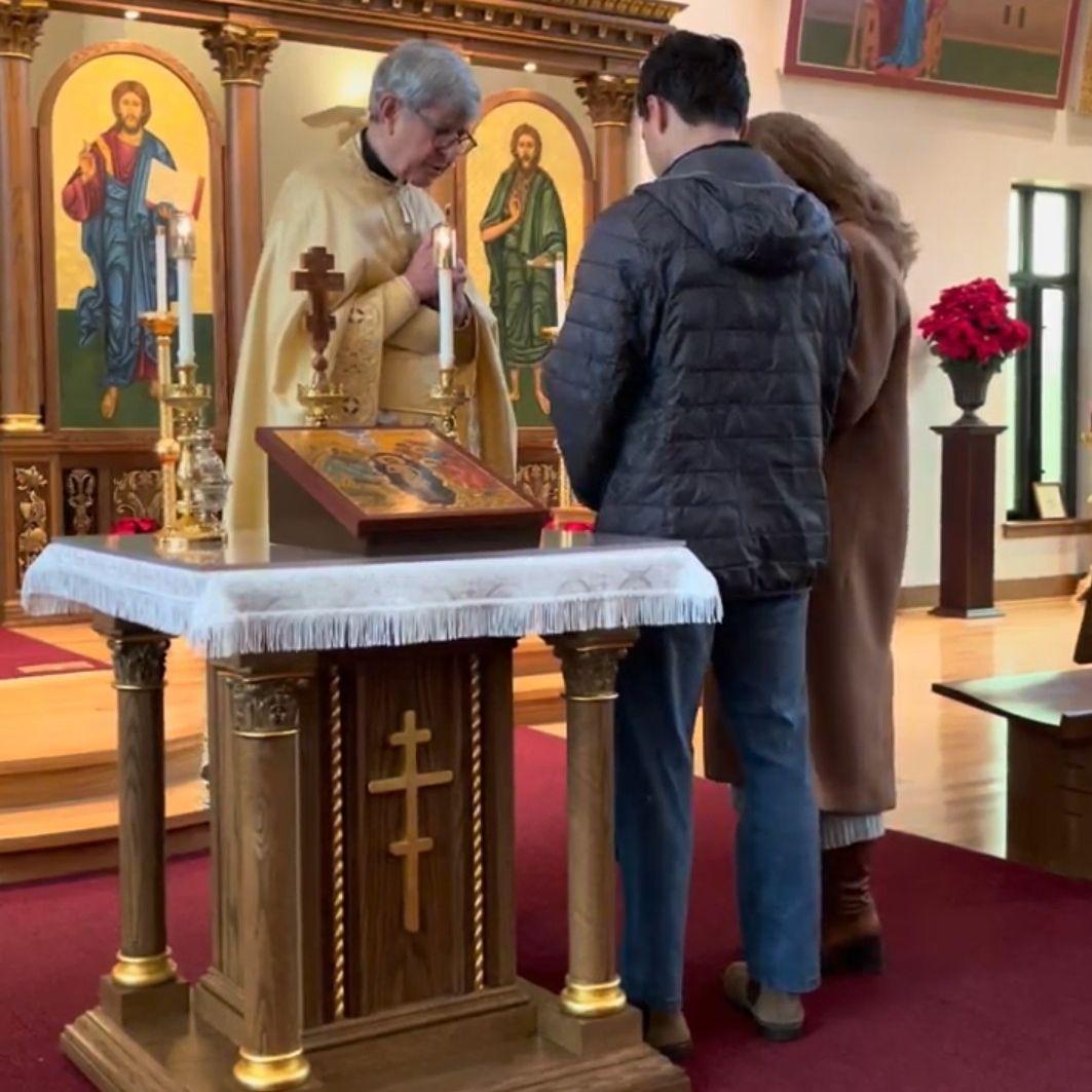 Getting a blessing from Fr. the Sunday after we got engaged.