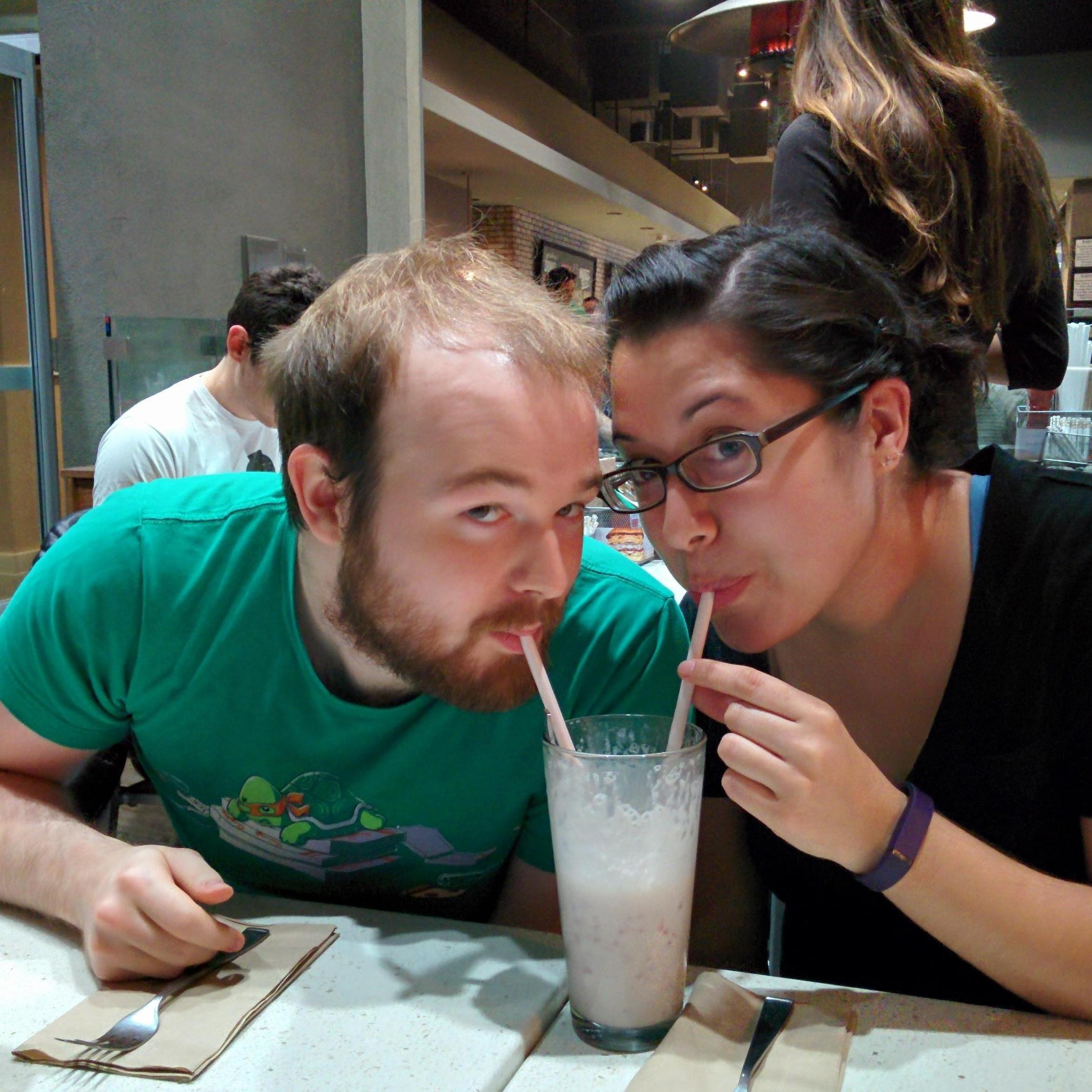 Sharing a milkshake!