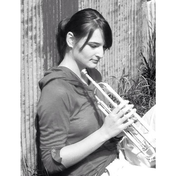 Senior pictures with her primary instrument, the trumpet