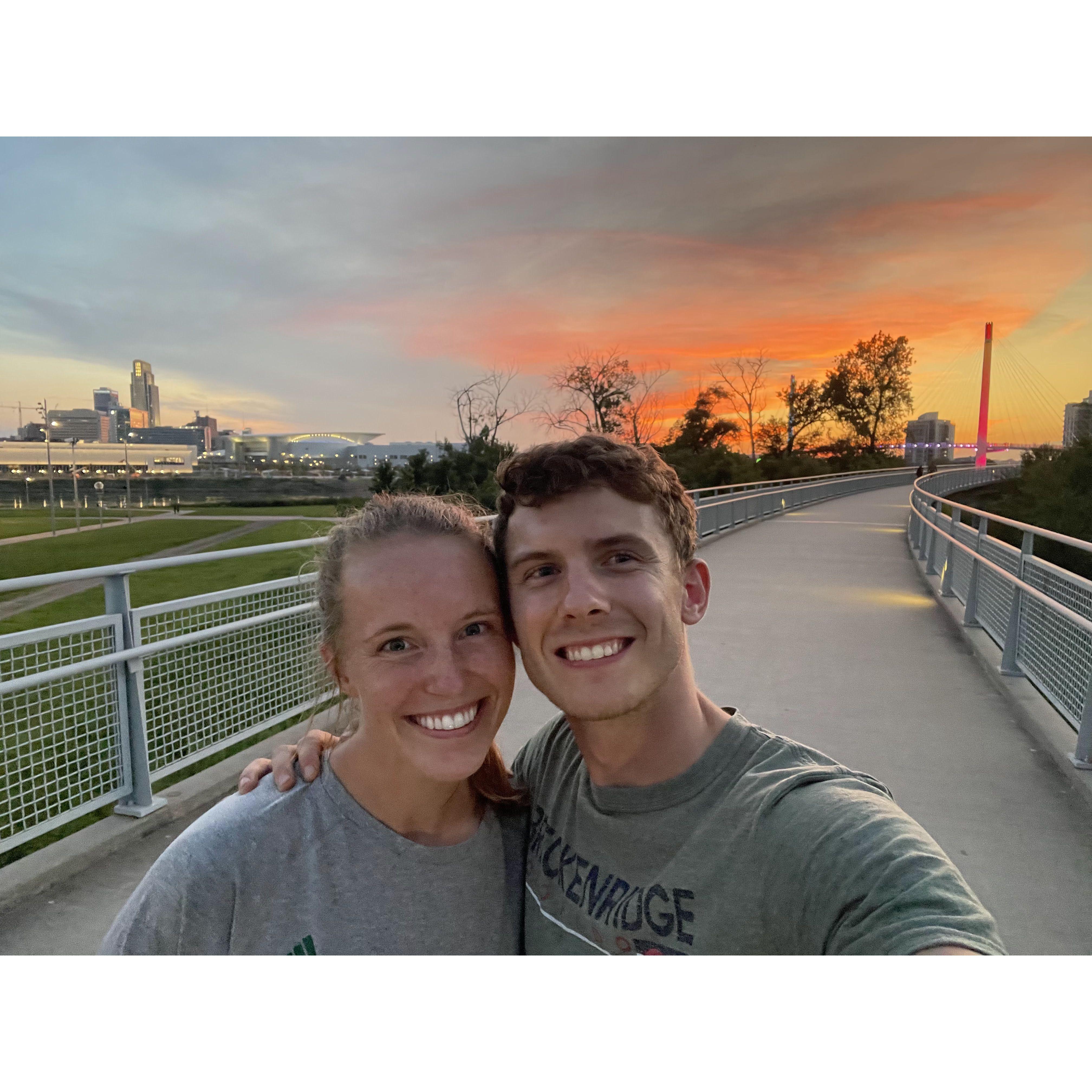 Although we're sweaty in this pic, it's one of our favorites because it's us walking across our favorite bridge into Iowa from the Omaha downtown area shown in the background. We love our walks!