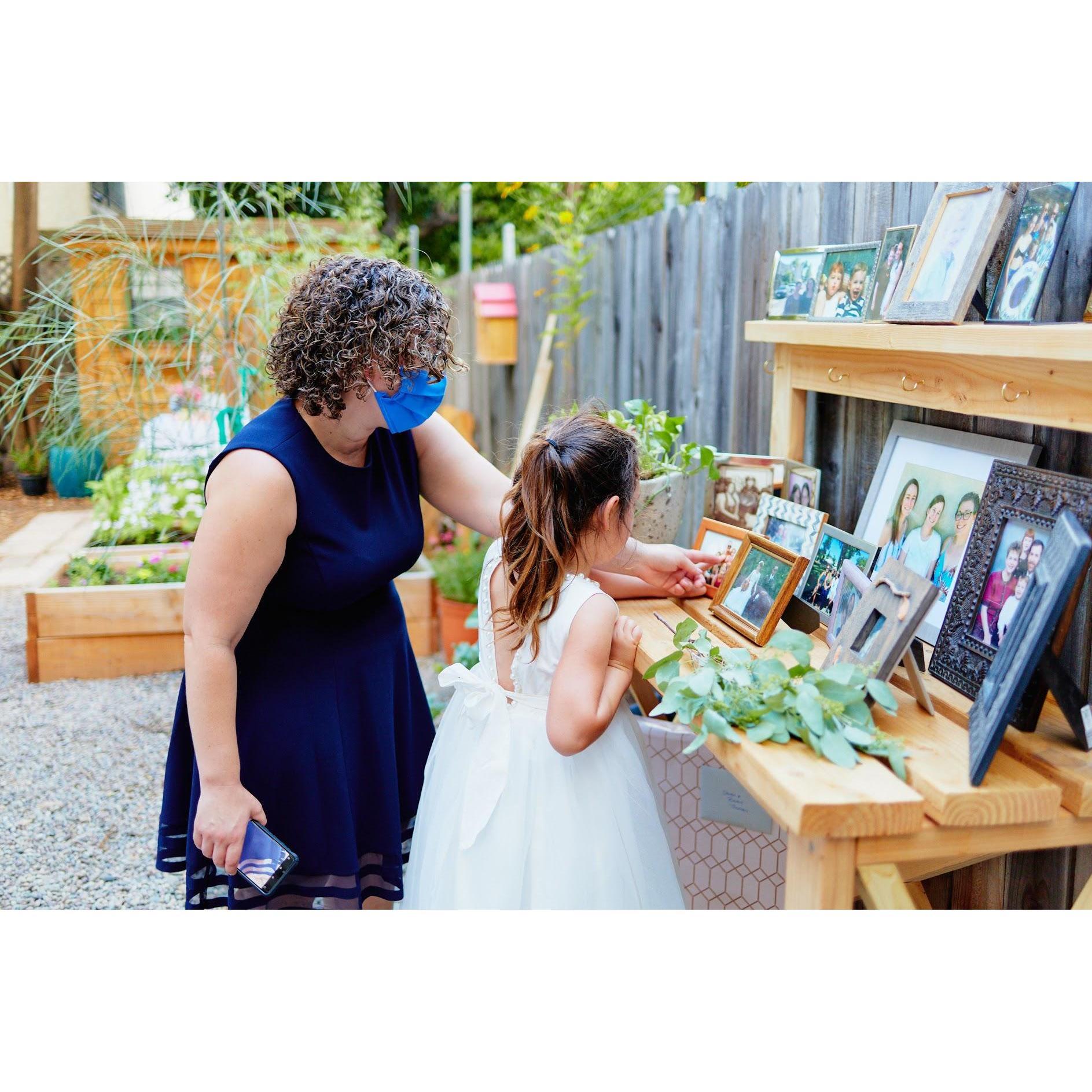 Rachel's sister Allison and niece Sofia admiring the photos