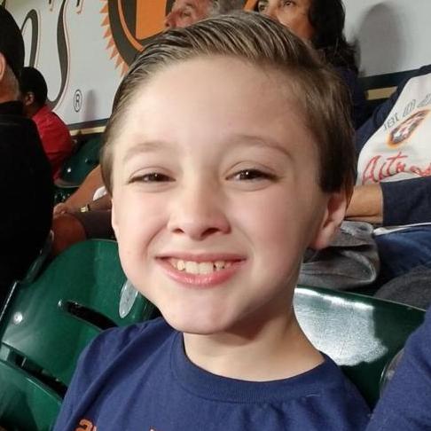 My handsome little man - eating all the goodies at the stadium!