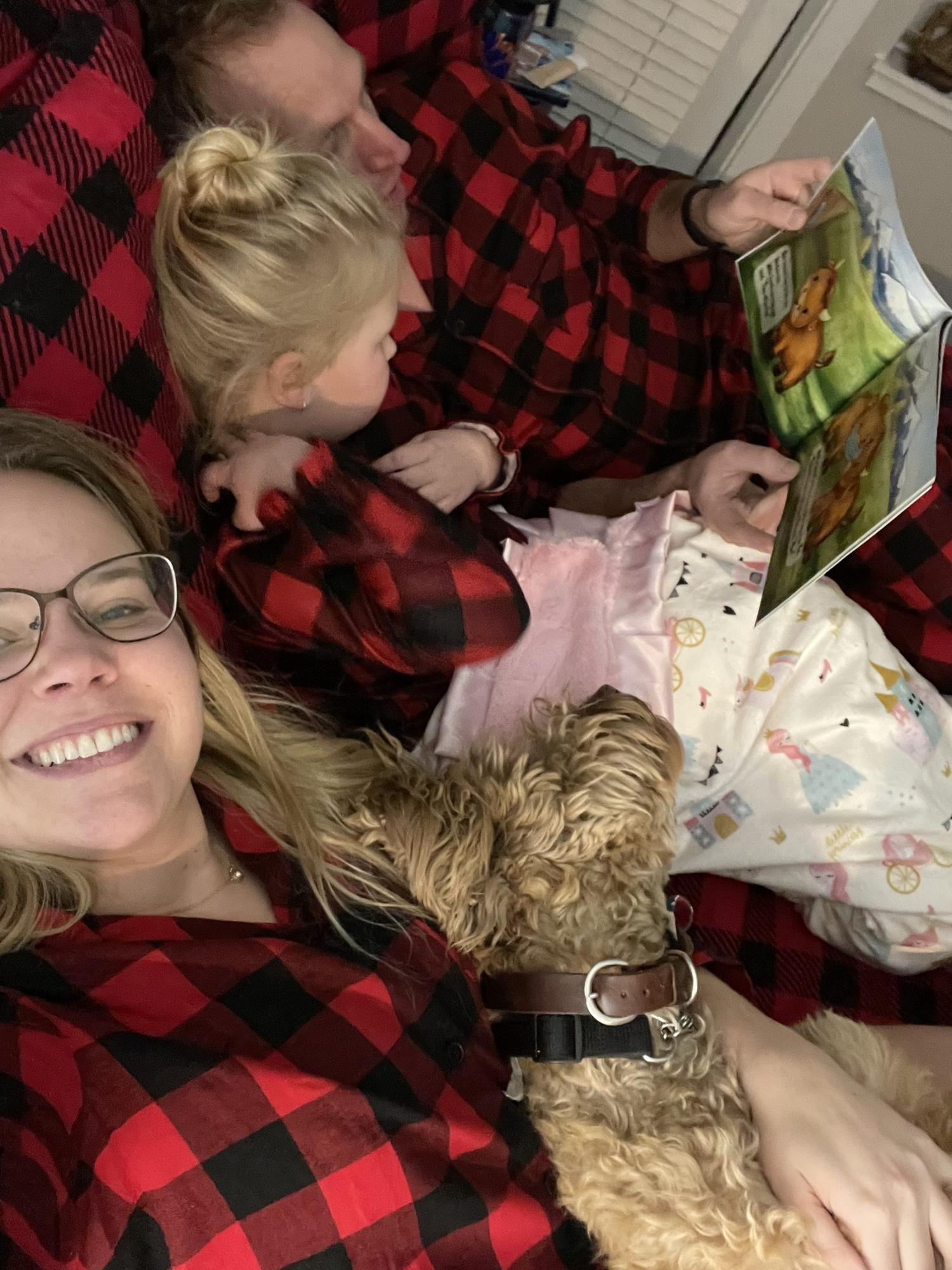 Tim, Addie, Zoe, and Alyssa all read Millie the Masked Musk Ox together in Christmas pajamas when Alyssa published her first children's book at the end of 2021