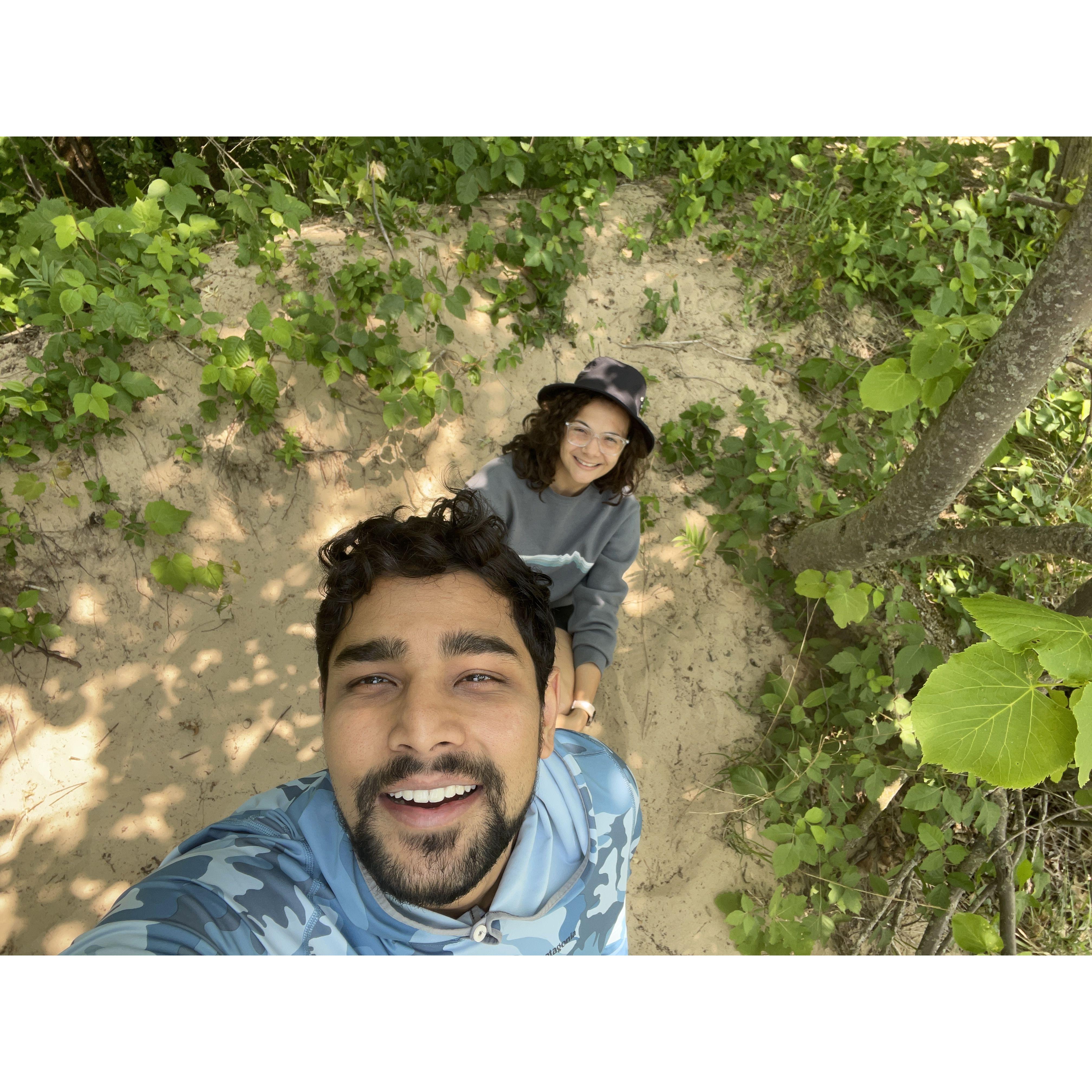 June 2023: Hiking up the dune, just before Burhan proposed.