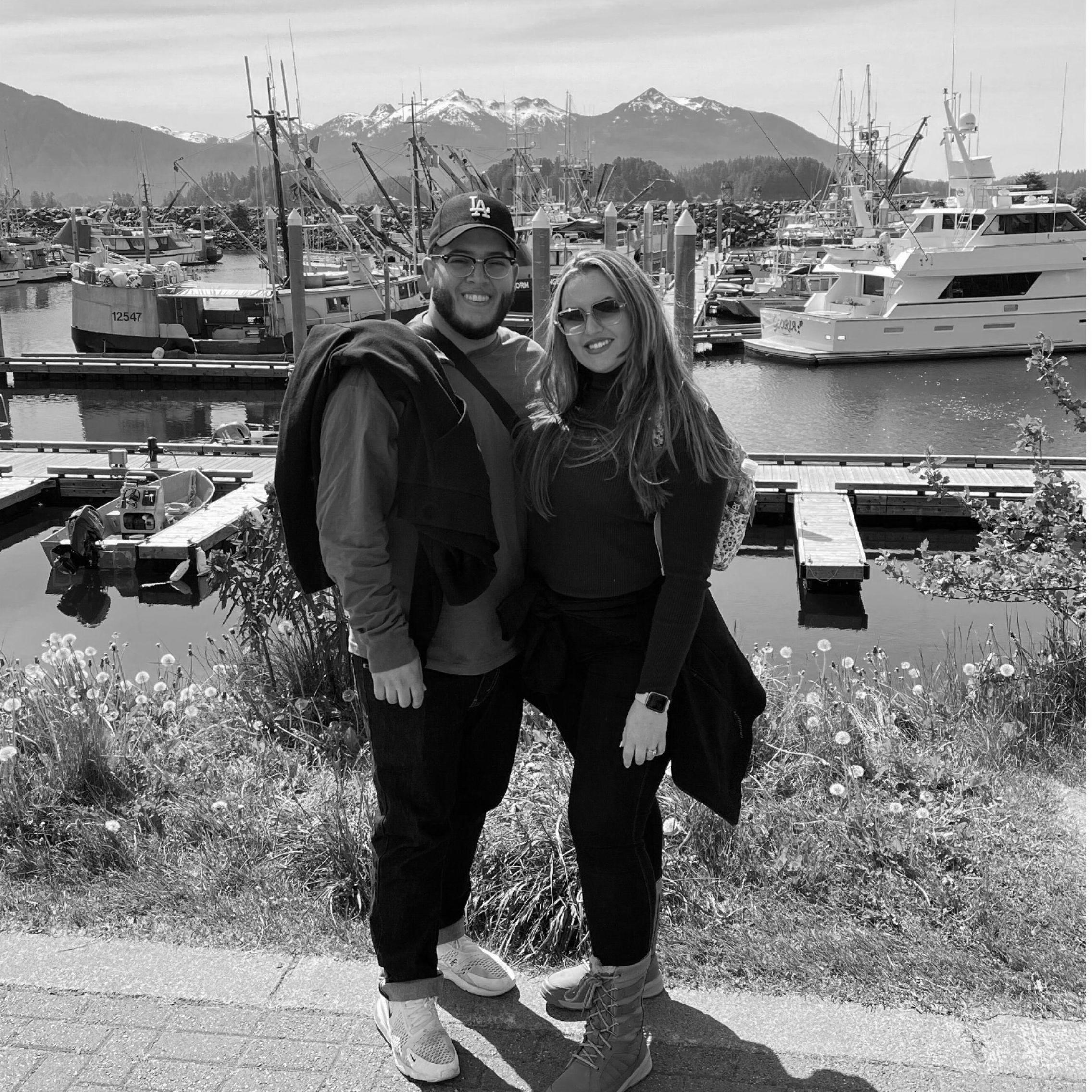 Vanessa wearing her "ice" while surrounded by ice posing with Jorge during their Alaska trip, May 2022