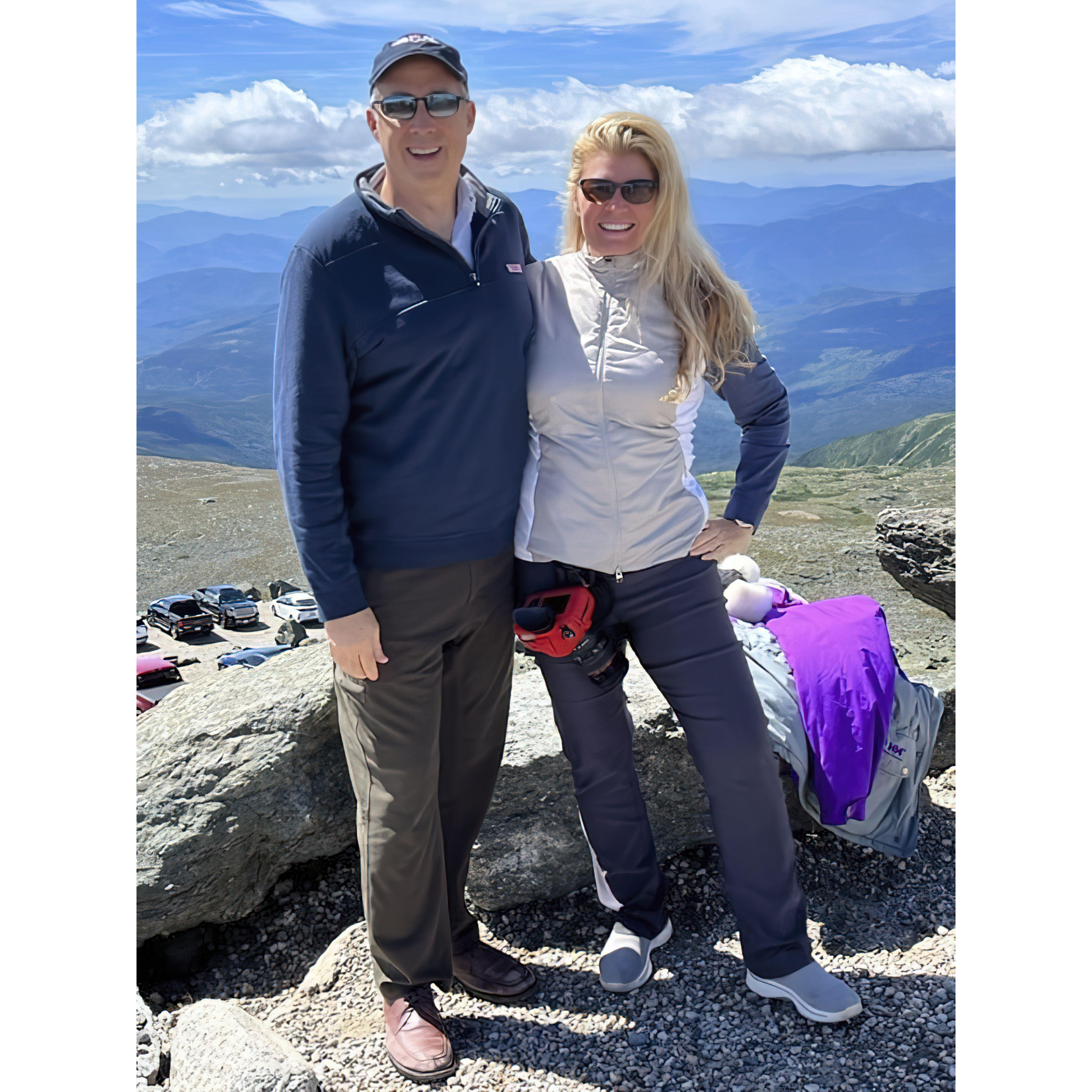 Reaching New Heights in Love. Atop Mt. Washington, officially designated as having the worst weather in the world - but these two bring blue skys with their sunny dispositions.