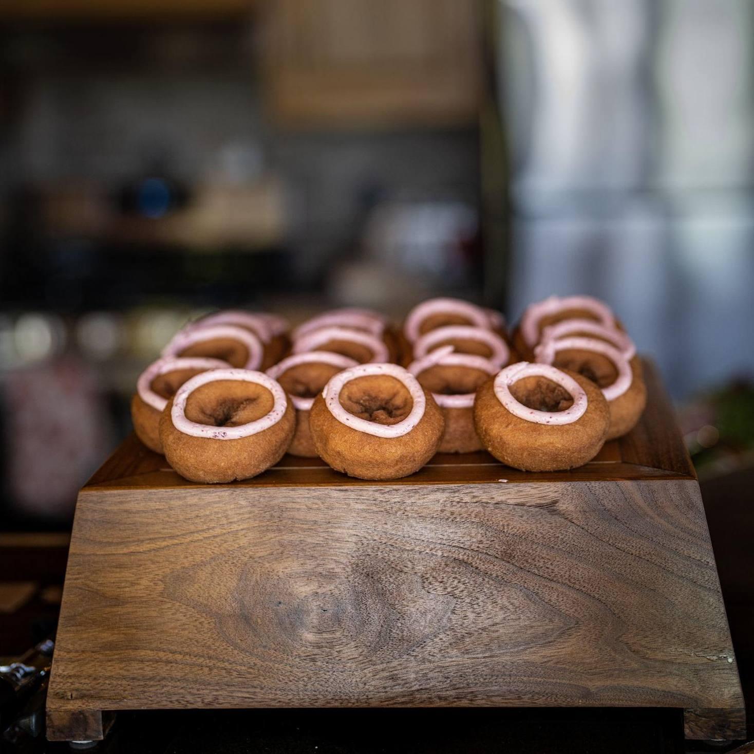 Thimbleberry doughnuts by Jamsen's Bakery displayed on cake stand made by Stassia's dad.