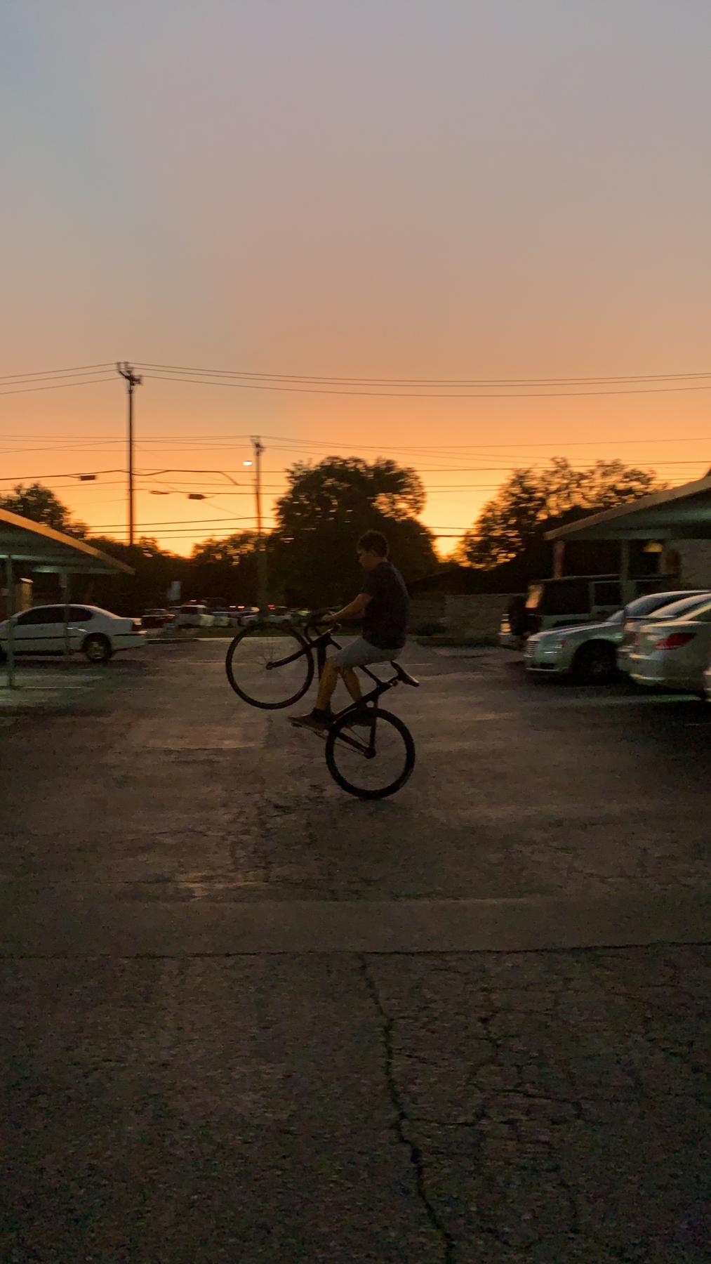 Forest mastering wheelies at our first apartment!