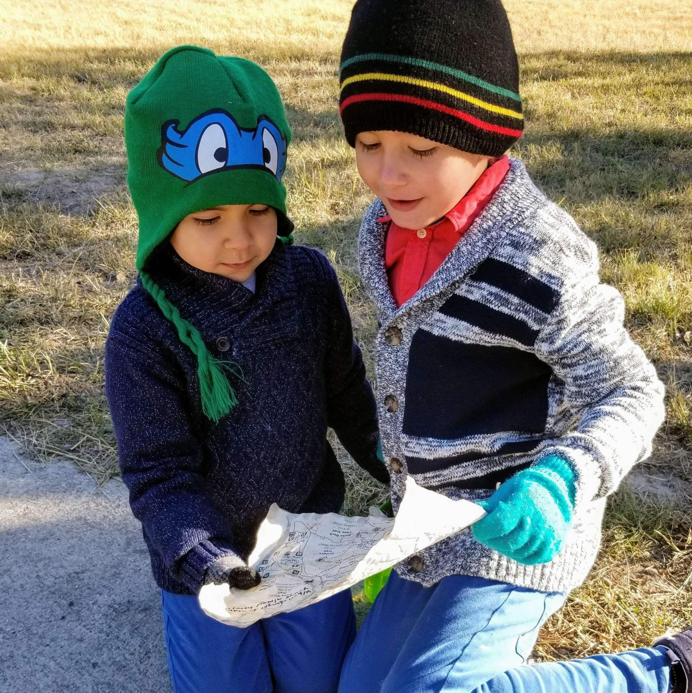 Calvin and Daniel helping me read the map that the "kidnappers" left