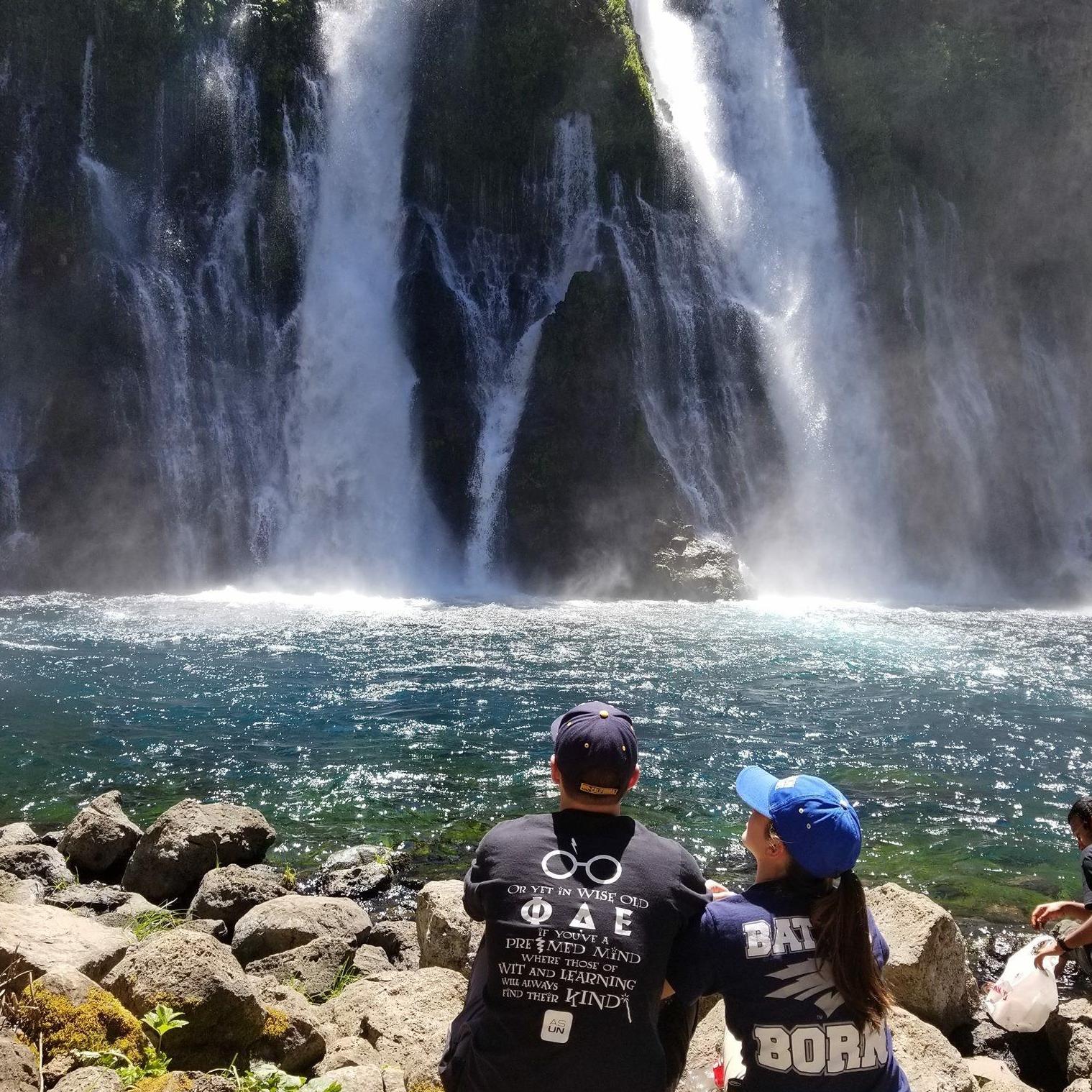 Sitting on the rocks enjoying Burney Falls on our anniversary trip 2017