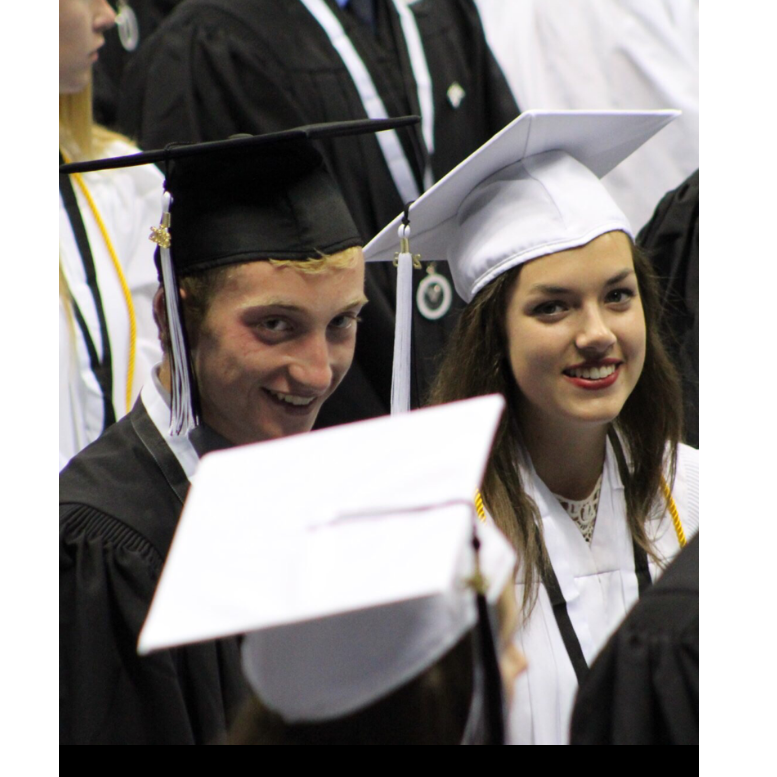 We got sat next to each other at our high school graduation! We were only dating a few weeks at this point - a crazy coincidence! 05/21/2016