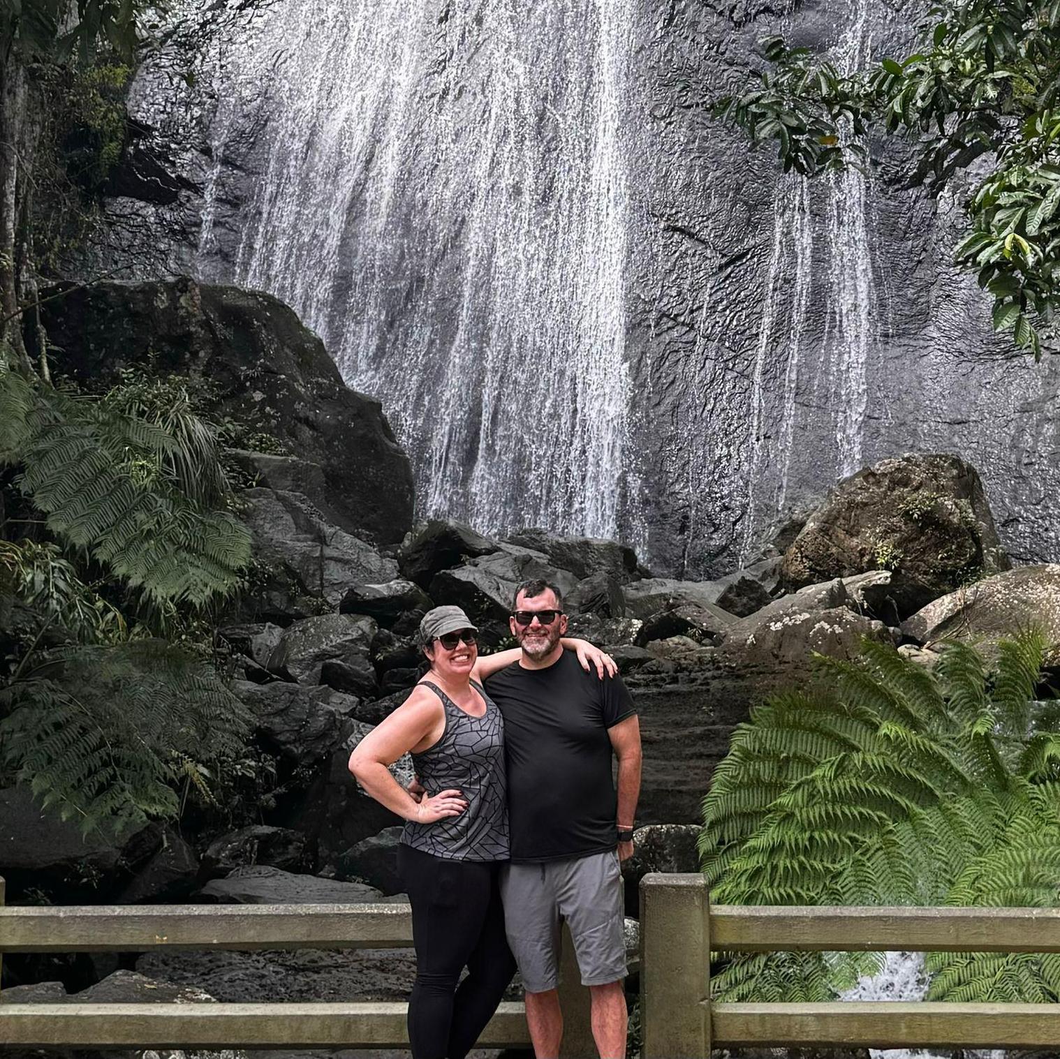 In front of an El Yunque waterfall after our hike