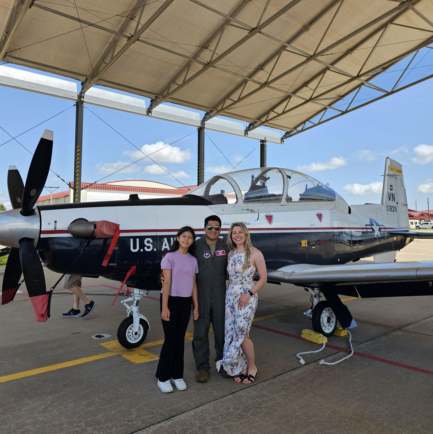 Cheyenne and Abby in front of the T-6