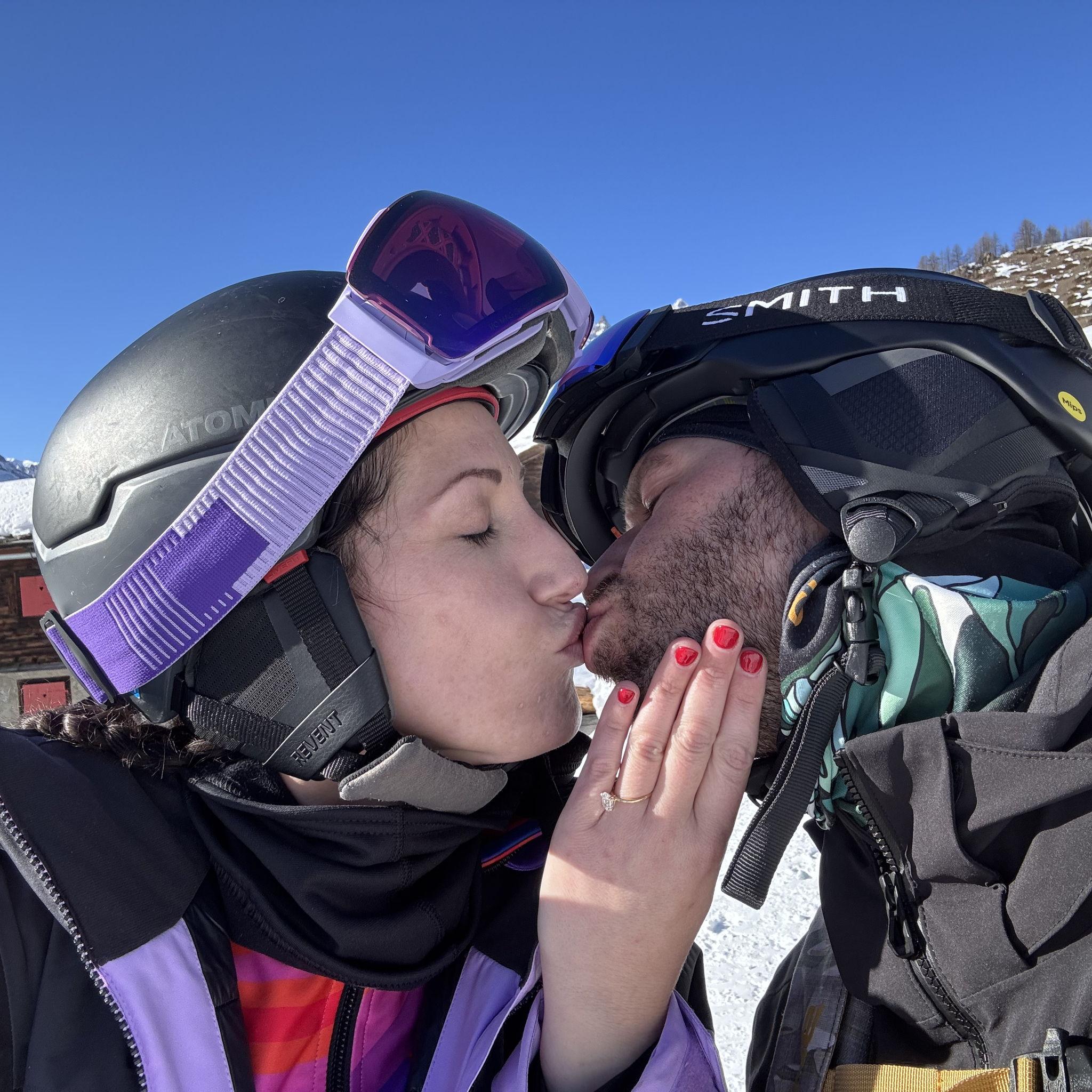 Engagement, sealed with a kiss, on the side of Piste 6 on Sunneggain the Swiss Alps.