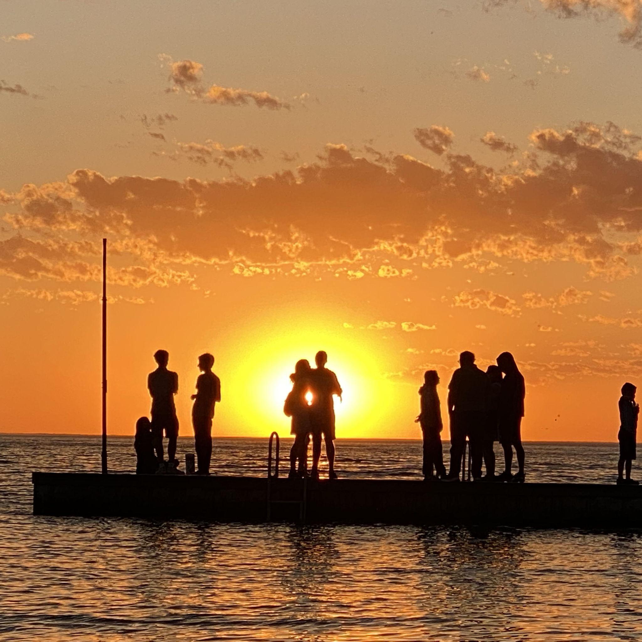 June 2021: Us in the sunset captured by strangers in Door County at the bay.