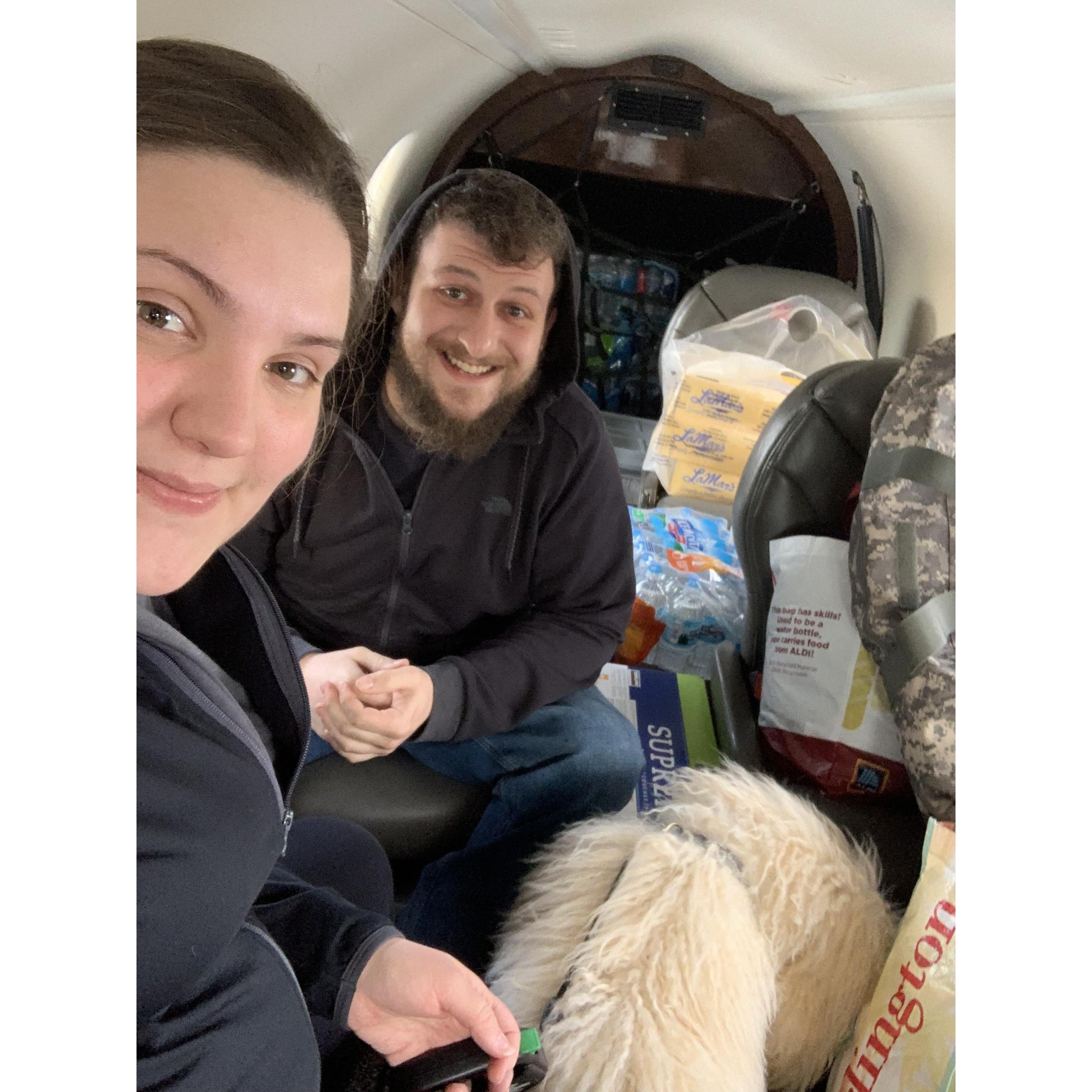 On a private plane headed to Fremont, NE to help flooding victims. We worked side by side for 19 hours a day and didn't kill each other.