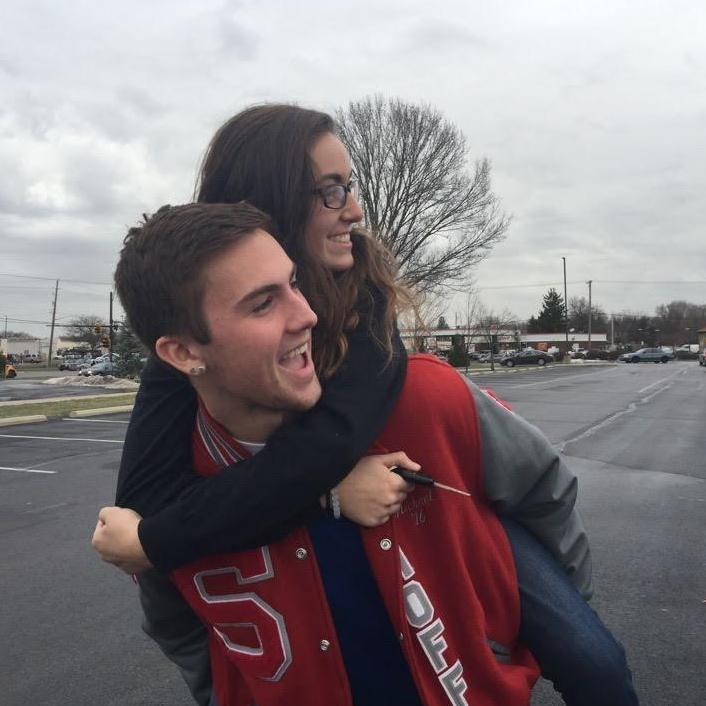 Senior year school parking lot. A friend across the parking lot yelled hi to us right when this picture was taken.