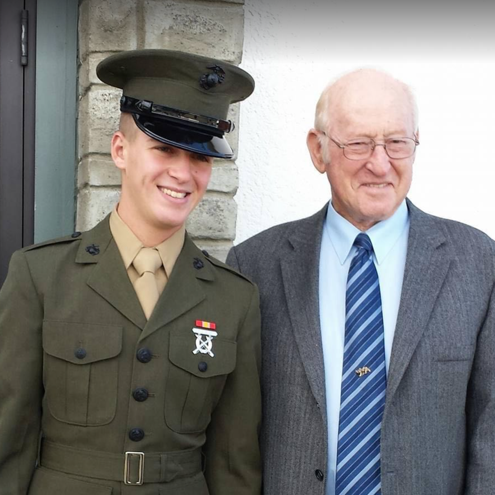 The groom in the Marine Corps with his Grandpa Don.