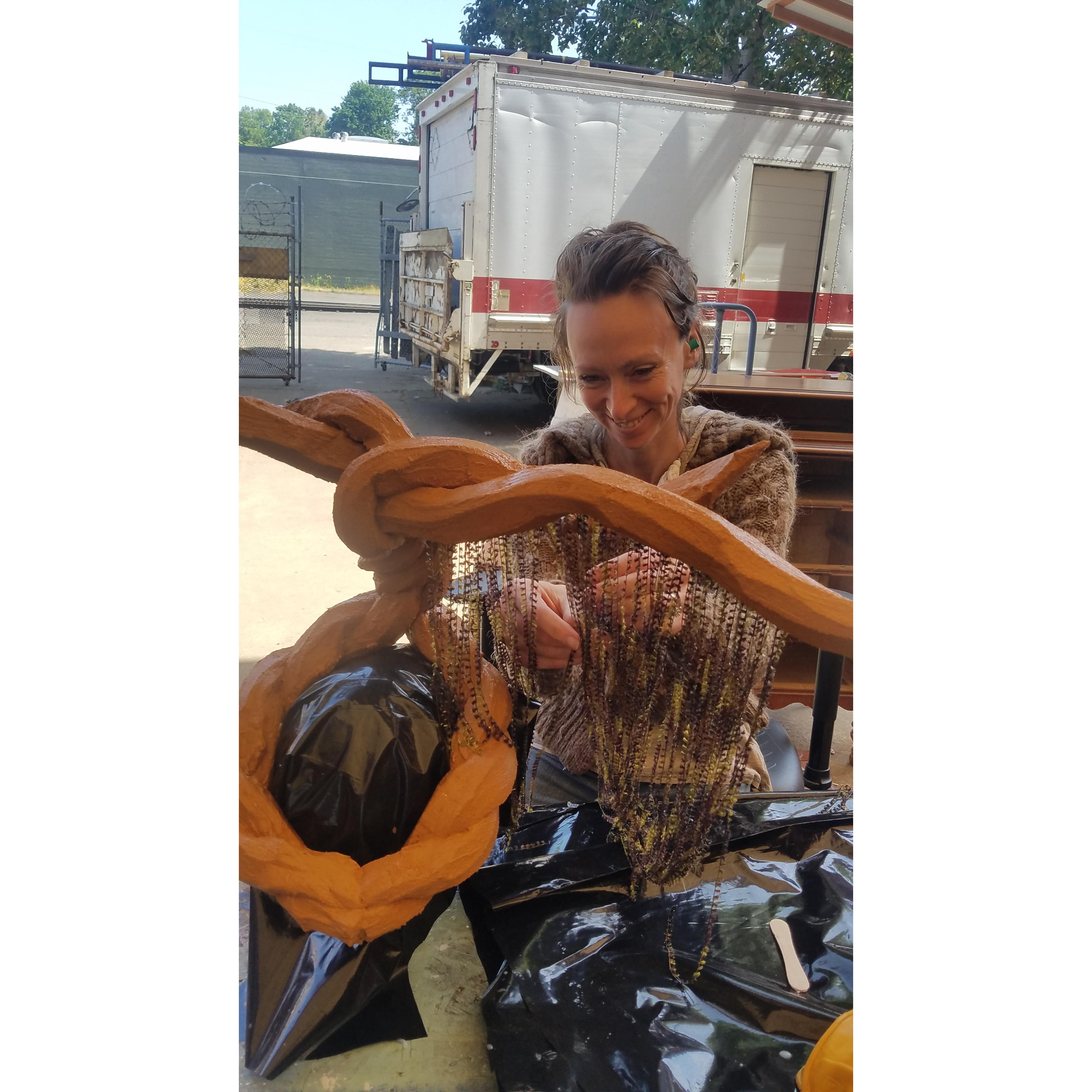 Current life, Heather making Banyan tree headdresses at the workshop.
