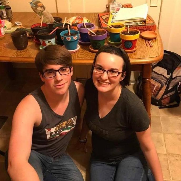 Meghan and Austin planting herbs and spices. Meghan even drove these to Houston while doing an internship at the Houston Zoo!