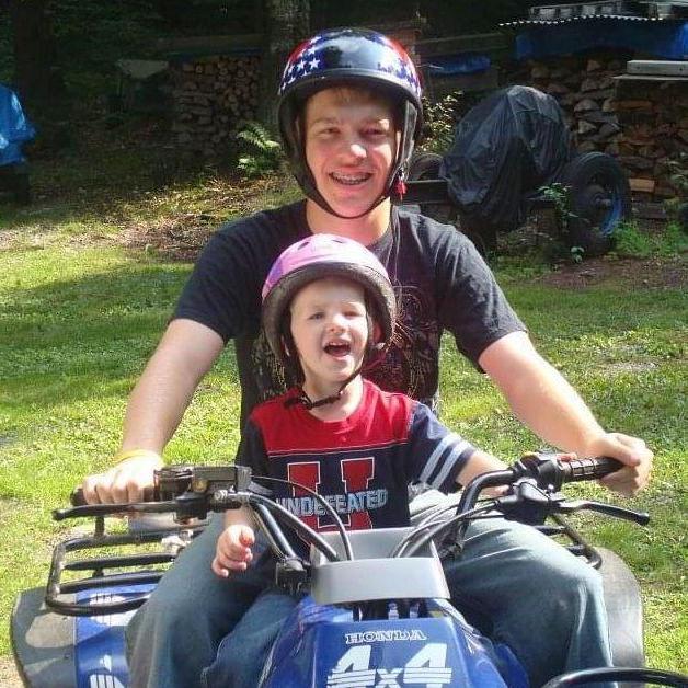 Showing Peyton some sick tricks on the 4 wheeler