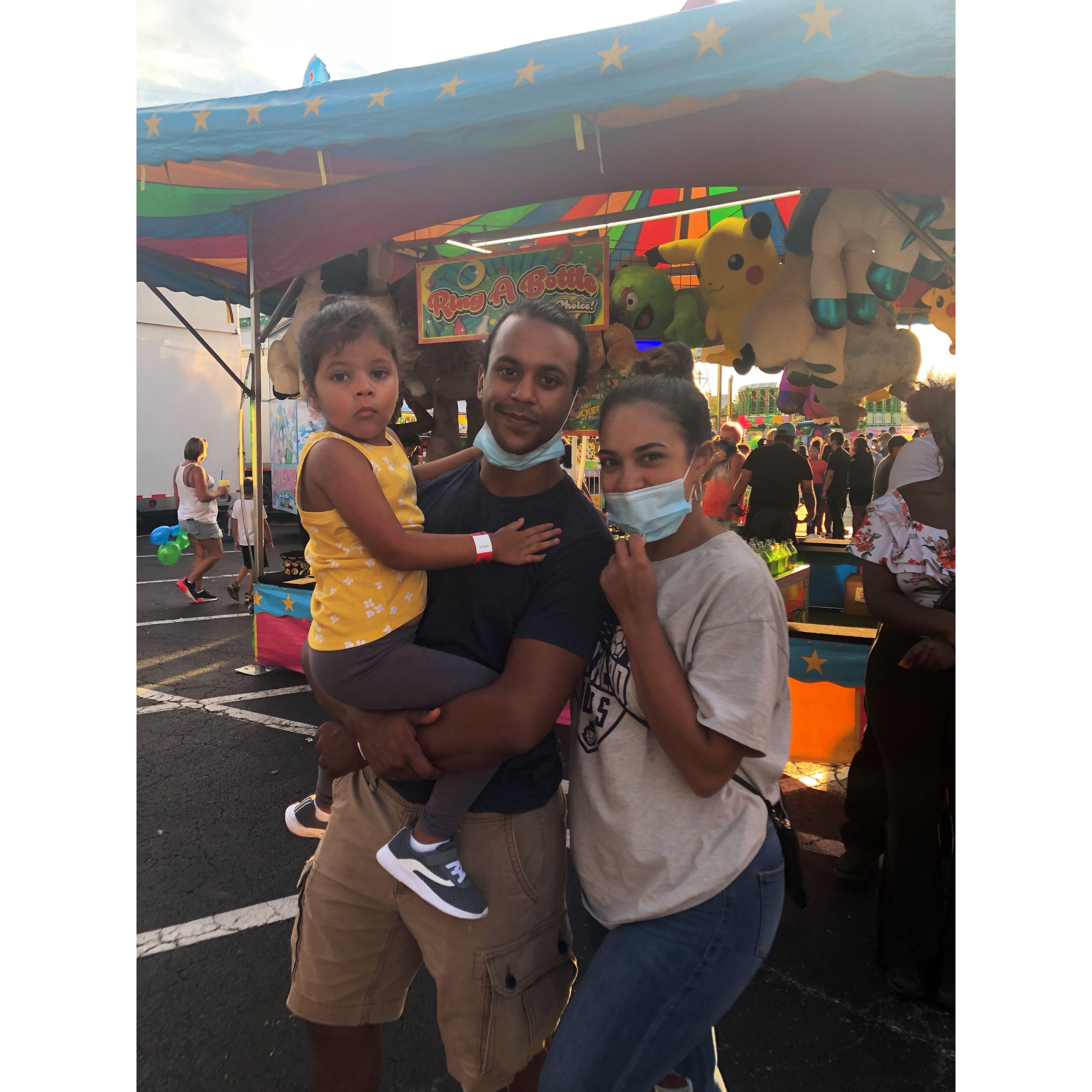 Taking Jamie to the carnival for the first time. Covid was still letting up (hence the masks).