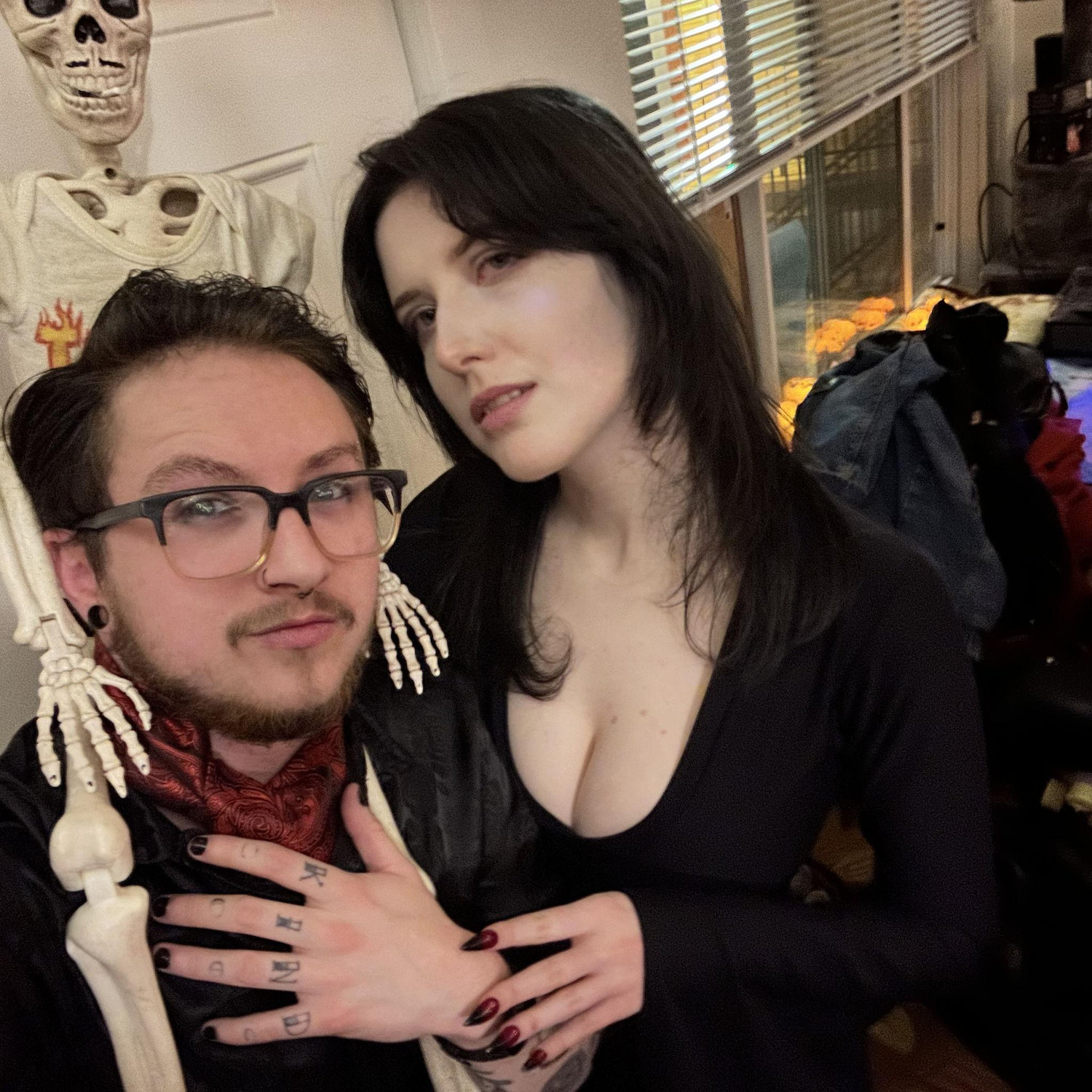 Gomez + Morticia (and our skeleton son, Gomey)
