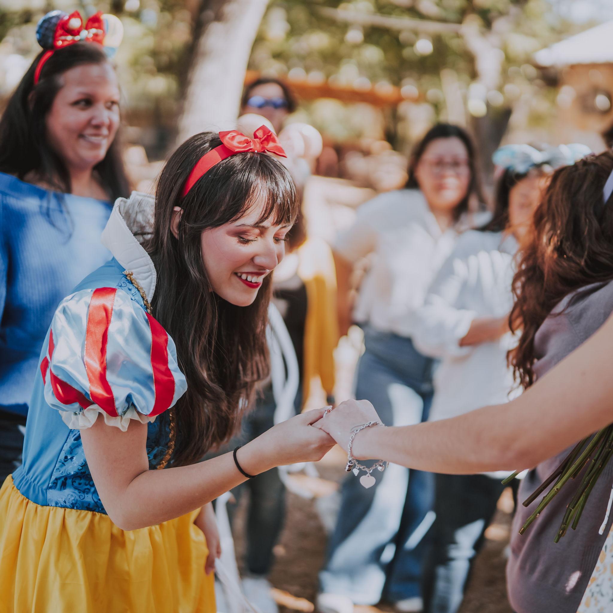 Ava looking at Ama's ring!
