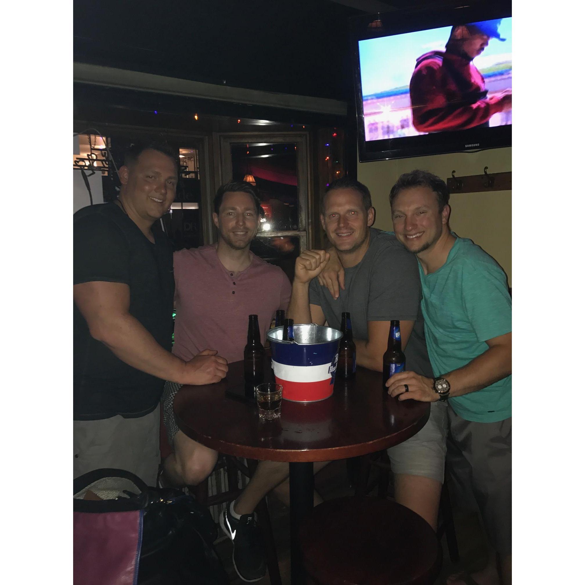 Where else but a dive bar with a bucket of beer.