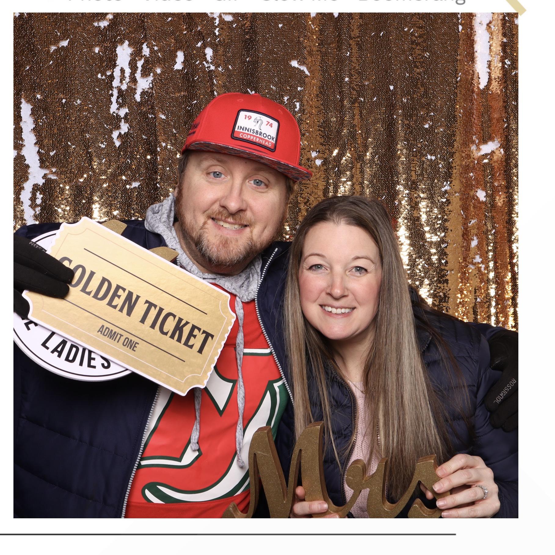 Checking out photo booths at a wedding expo 2023