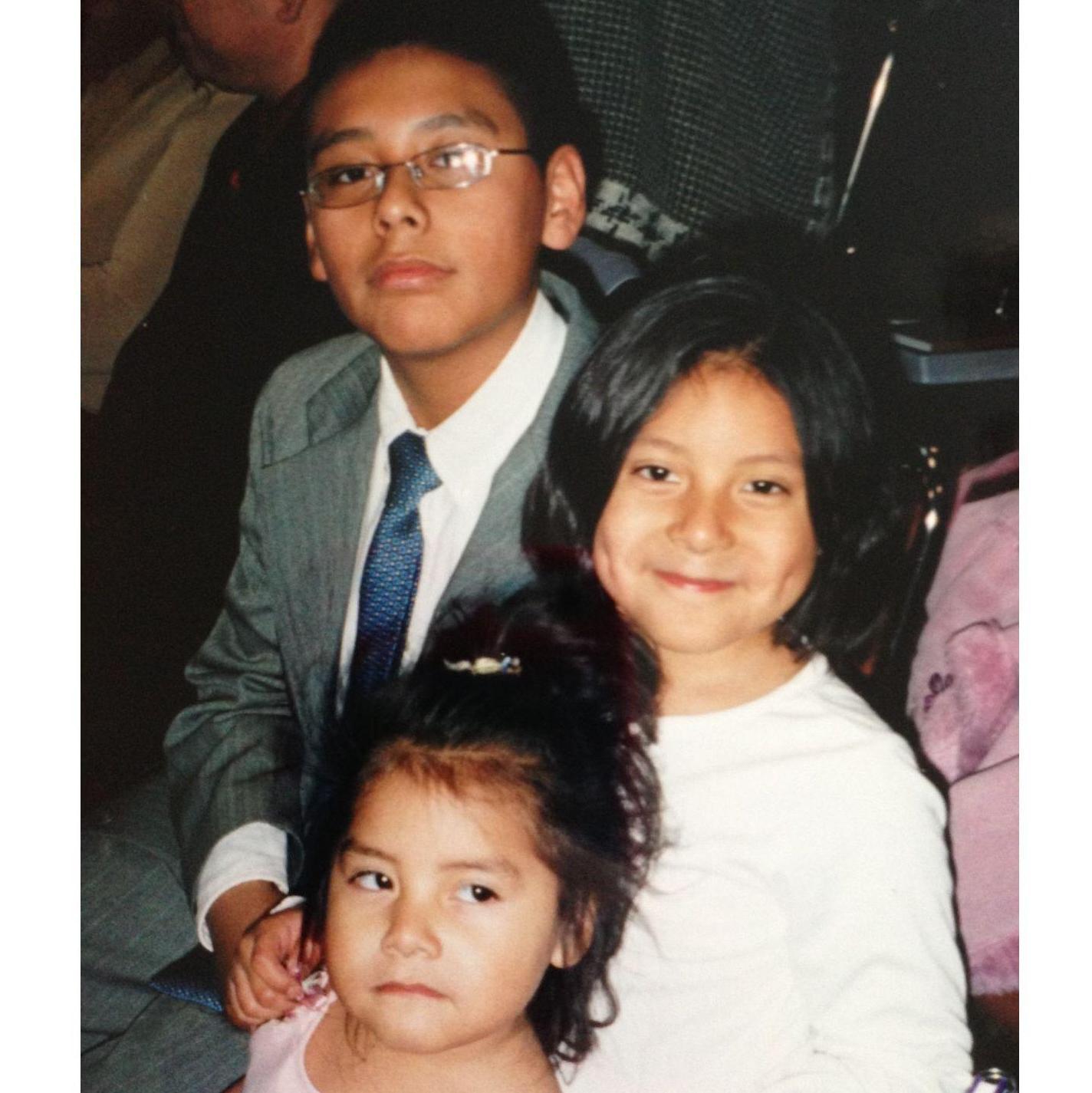 With siblings at assembly (brother Gerardo, sister Isabella)