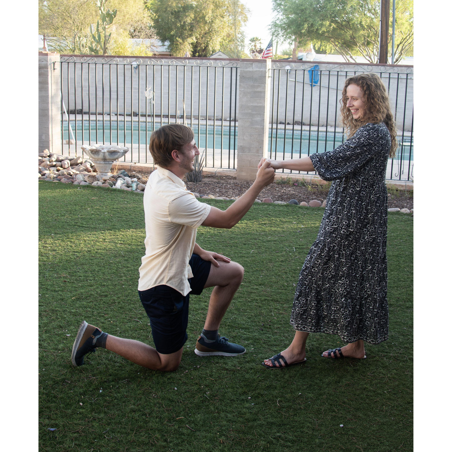 2025 engagement photo in Grandma's backyard
