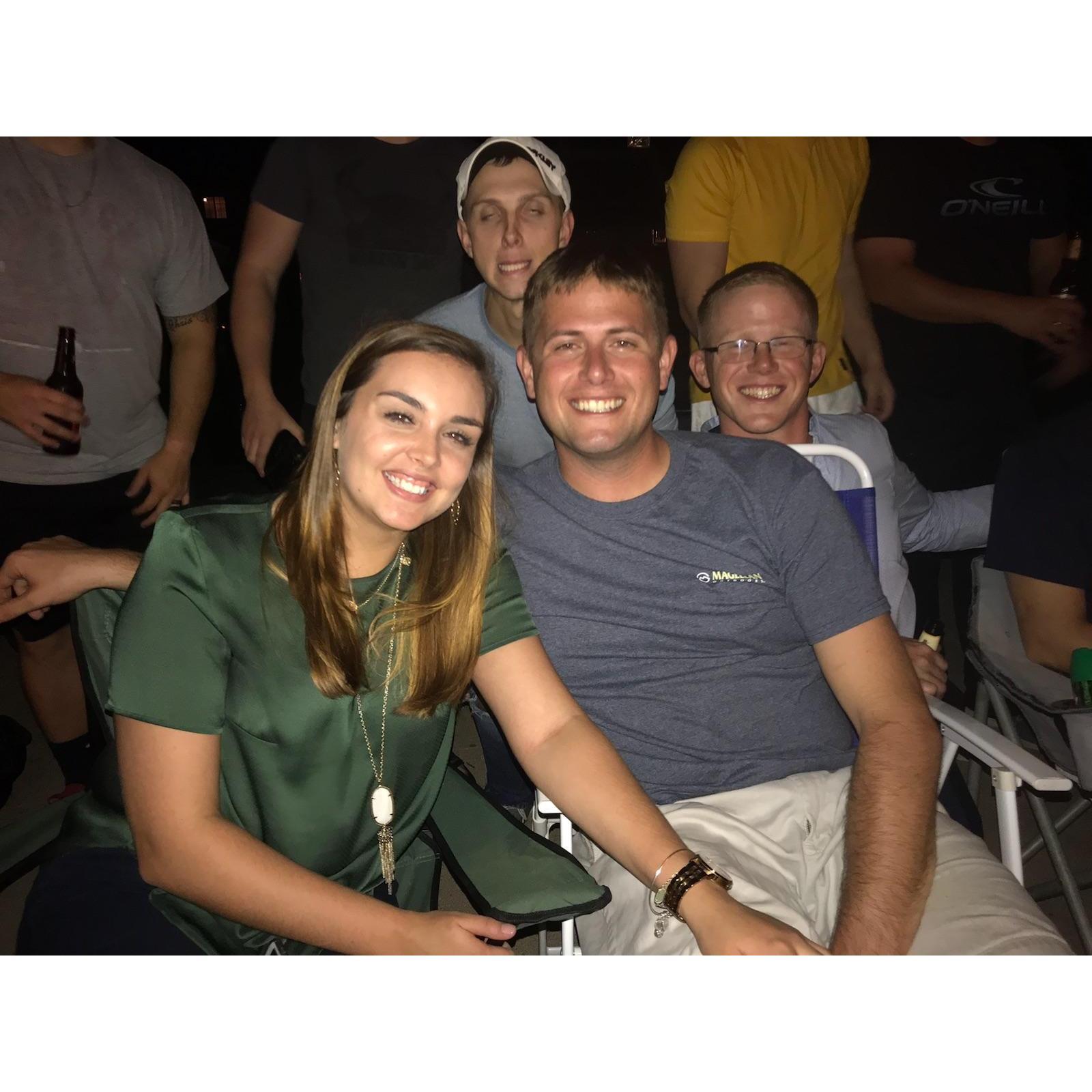 The first picture we ever took together (thanks Garrett for the photobomb)!