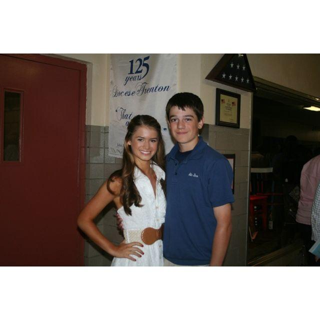 The first photo we took together in the hallway of our high school, Notre Dame.