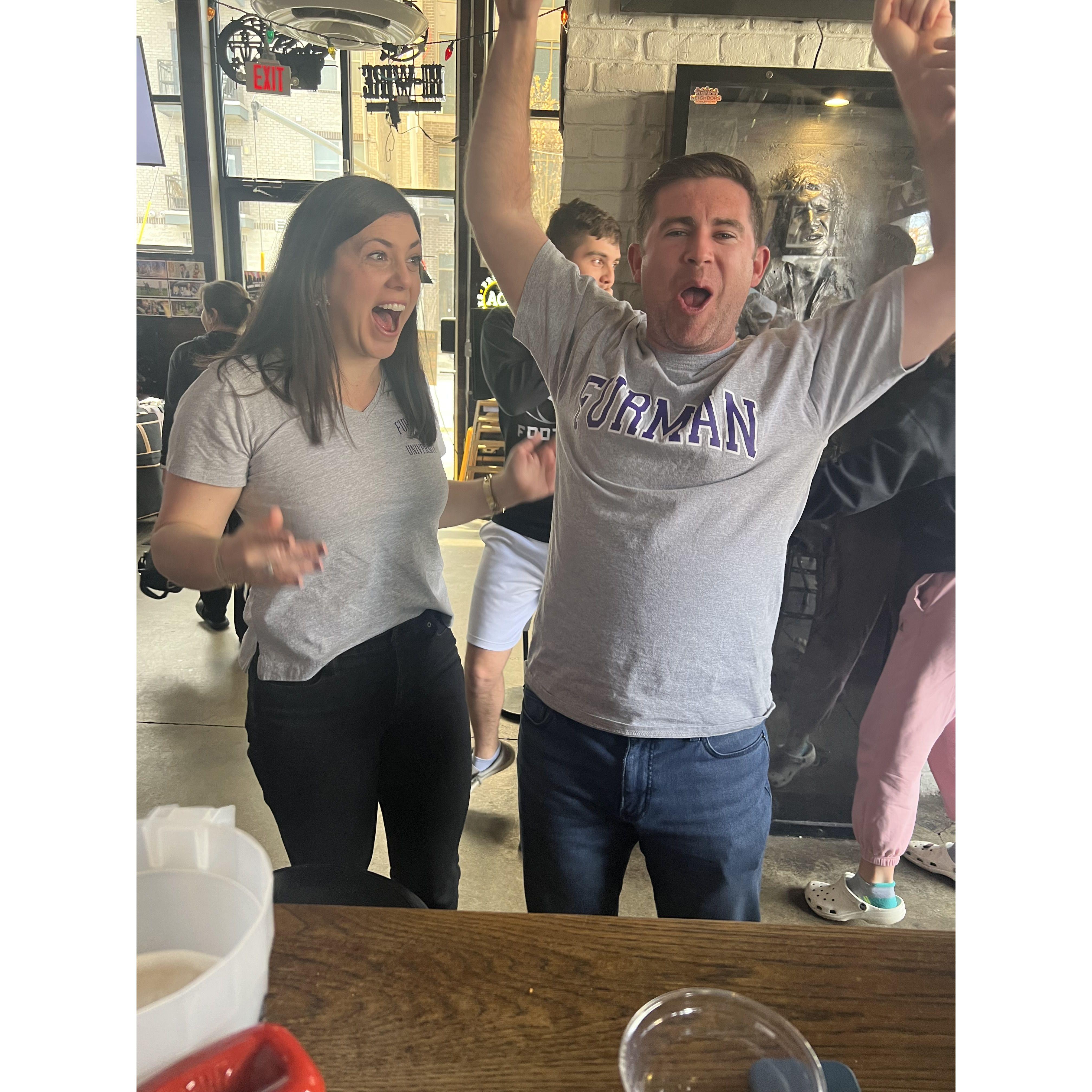 Celebrating Furman's big March Madness win over the University of Virginia.