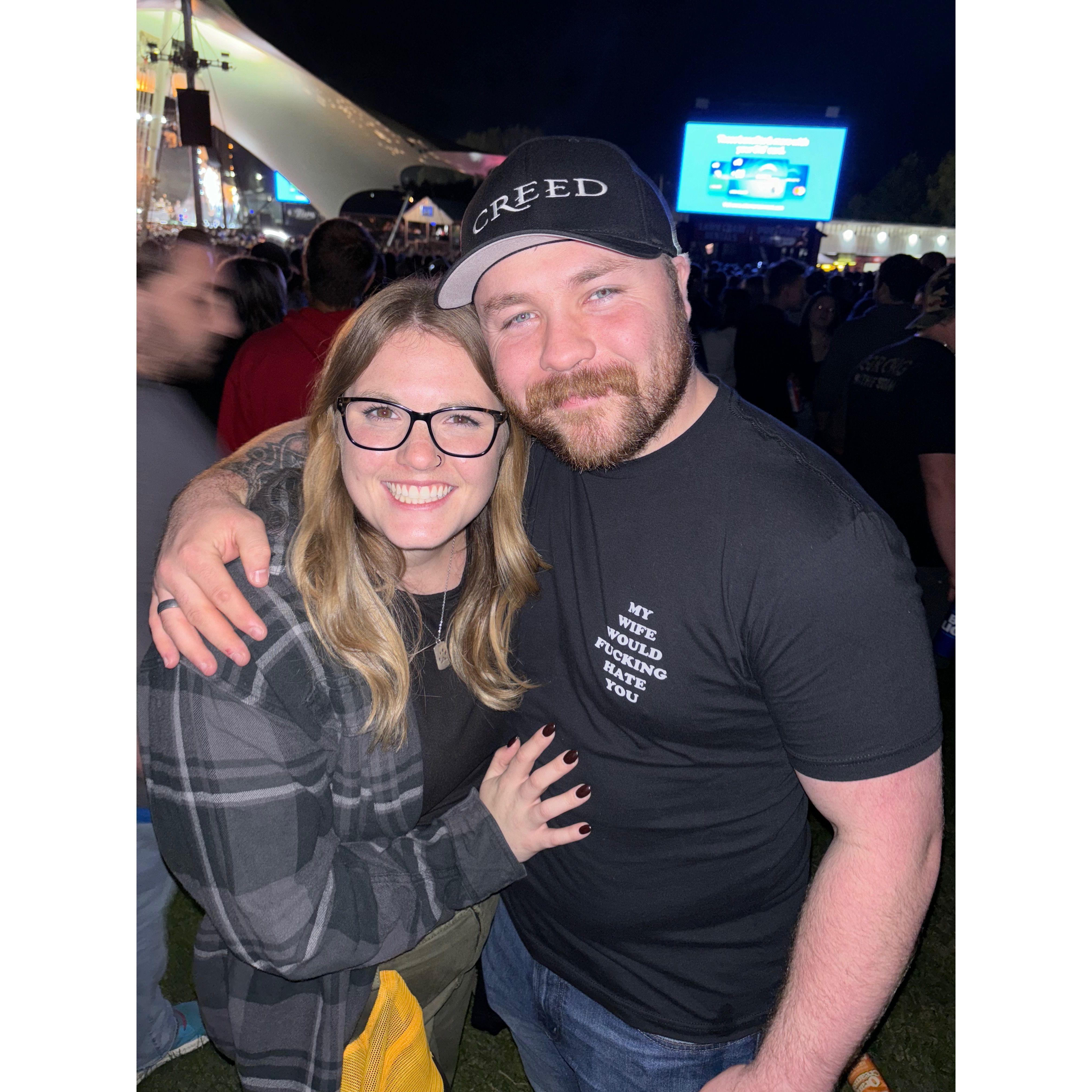 Us attending a Creed concert exactly 1 year before our wedding.