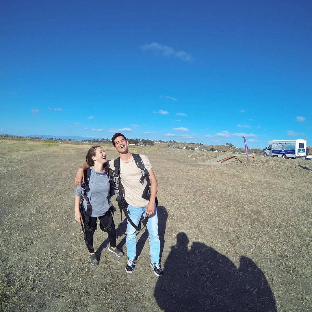 This photo was taken after we went skydiving! We were both in utter shock!