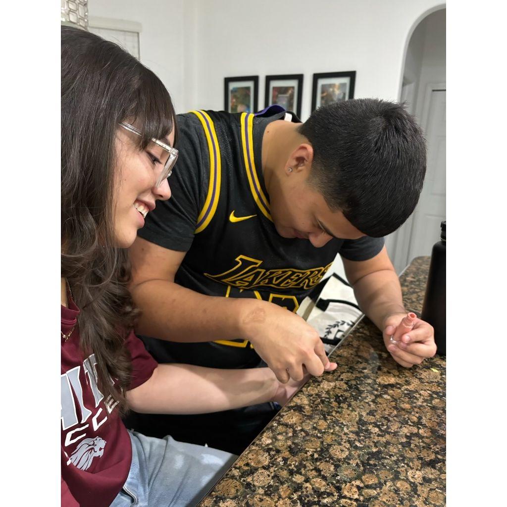 Axel attempting to do Desiree's nails