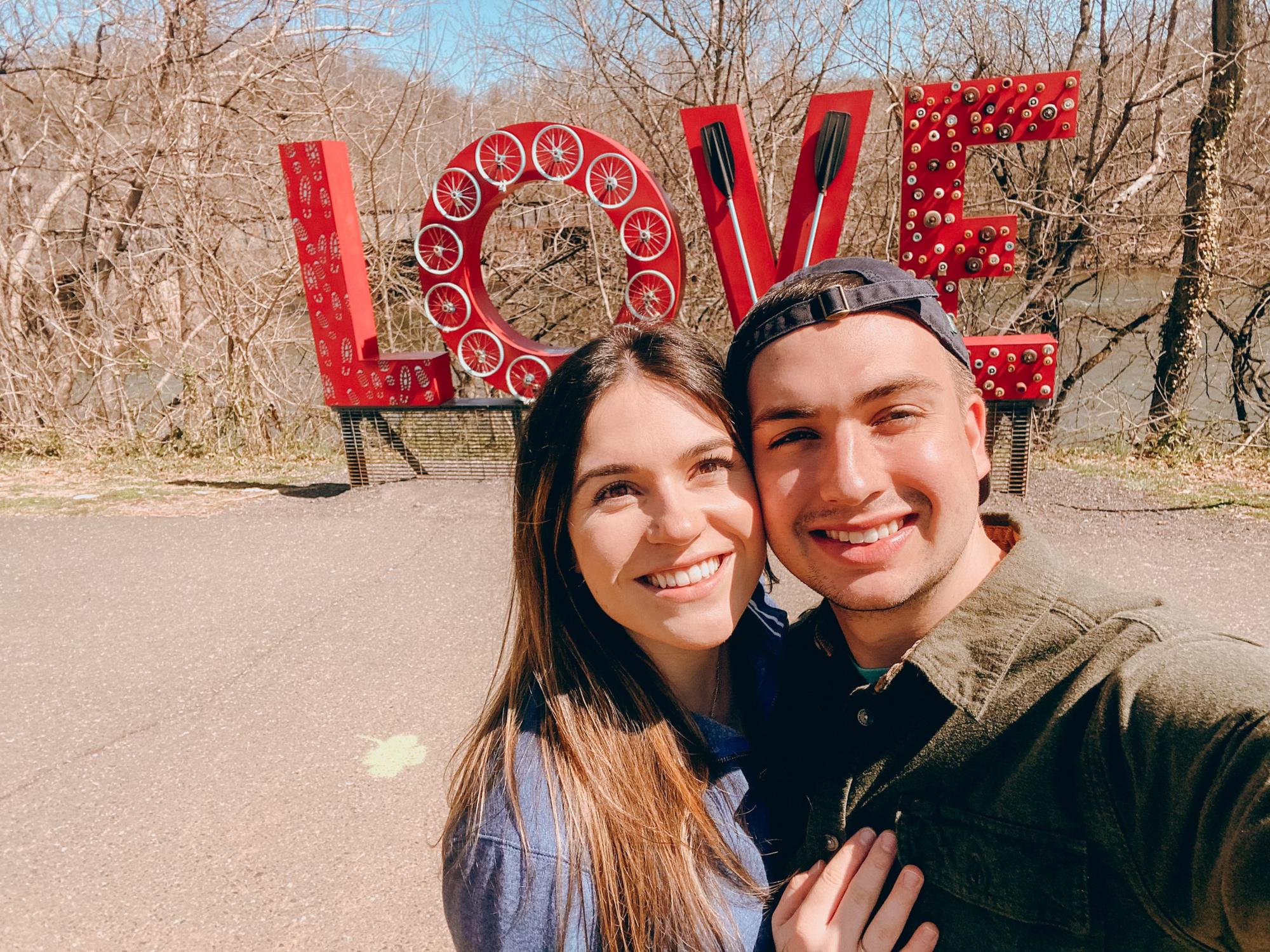 young love at the love sign in Lynchburg, VA