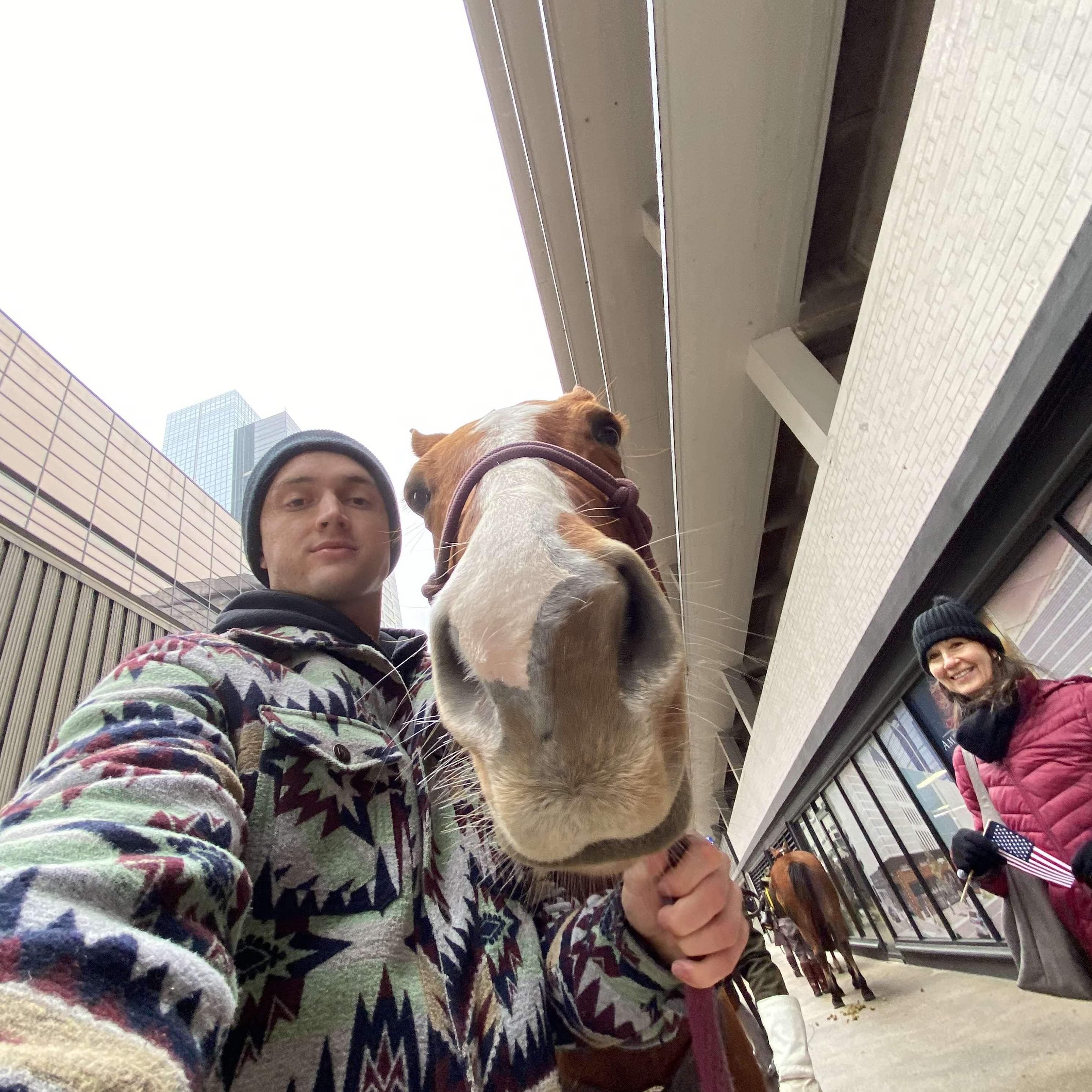 Here is Nathan holding my energetic horse, Roy, with my mom looking very gleeful nearby!