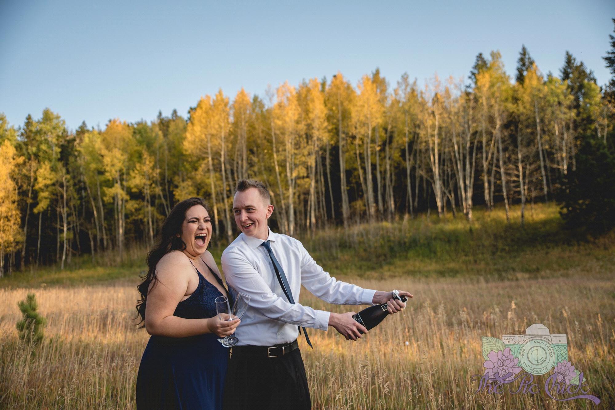 Kyle sprayed us with champagne. I really enjoy our expressions and the trees behind us.