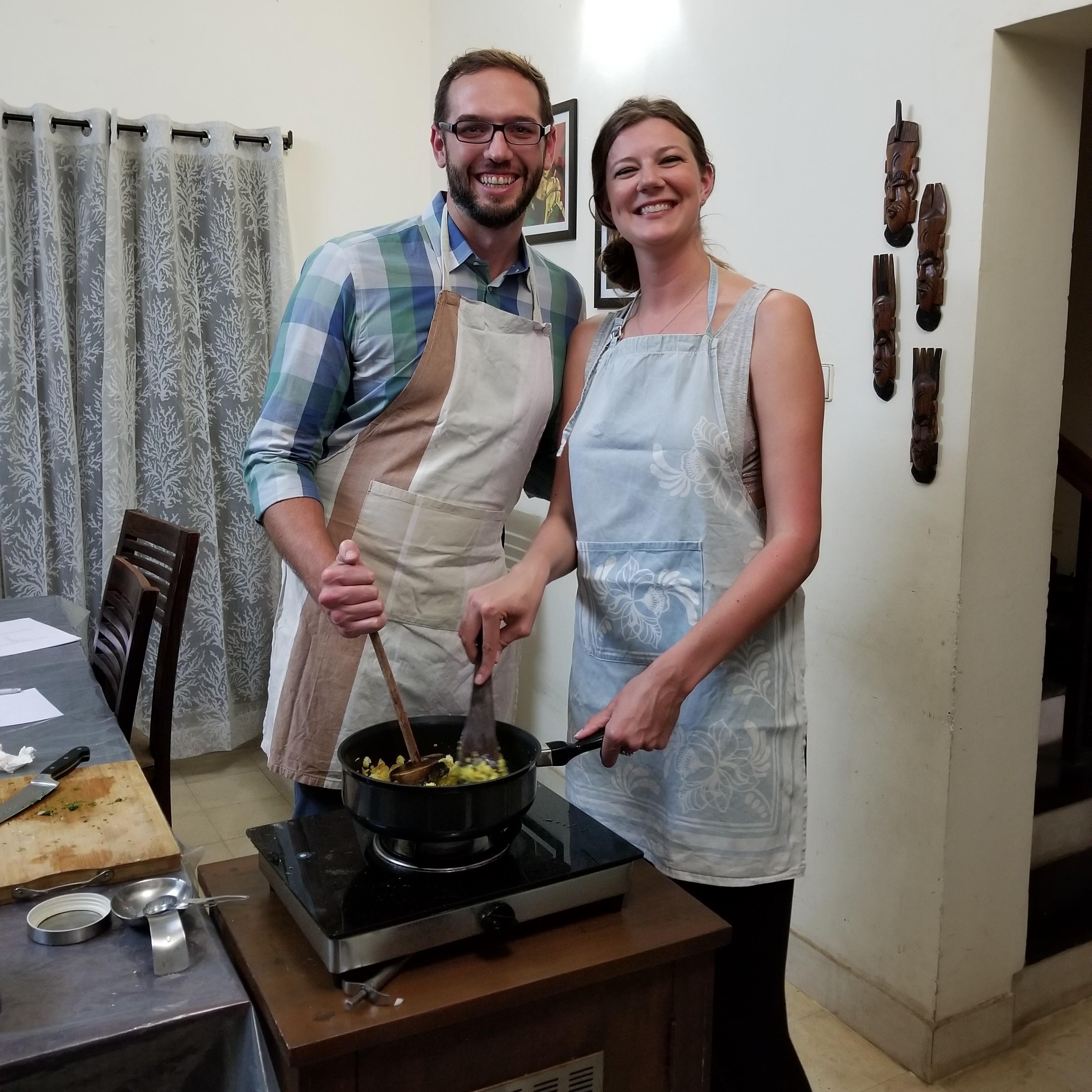 We love to cook together. This is us taking a cooking class in India.