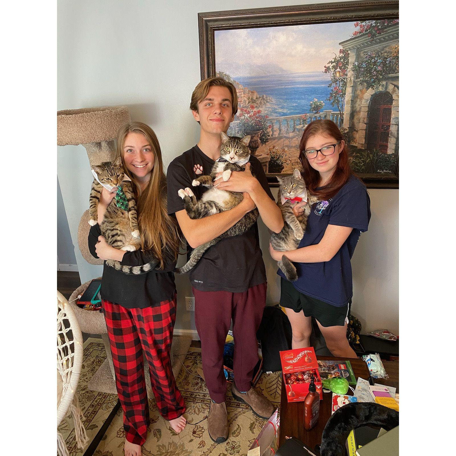 This Christmas we gave Leo, Maverick, and Iris some fashionable attire. Alyssa was super happy and I (James) am wearing my brand new cloggs (shoes) I got from Alyssa!