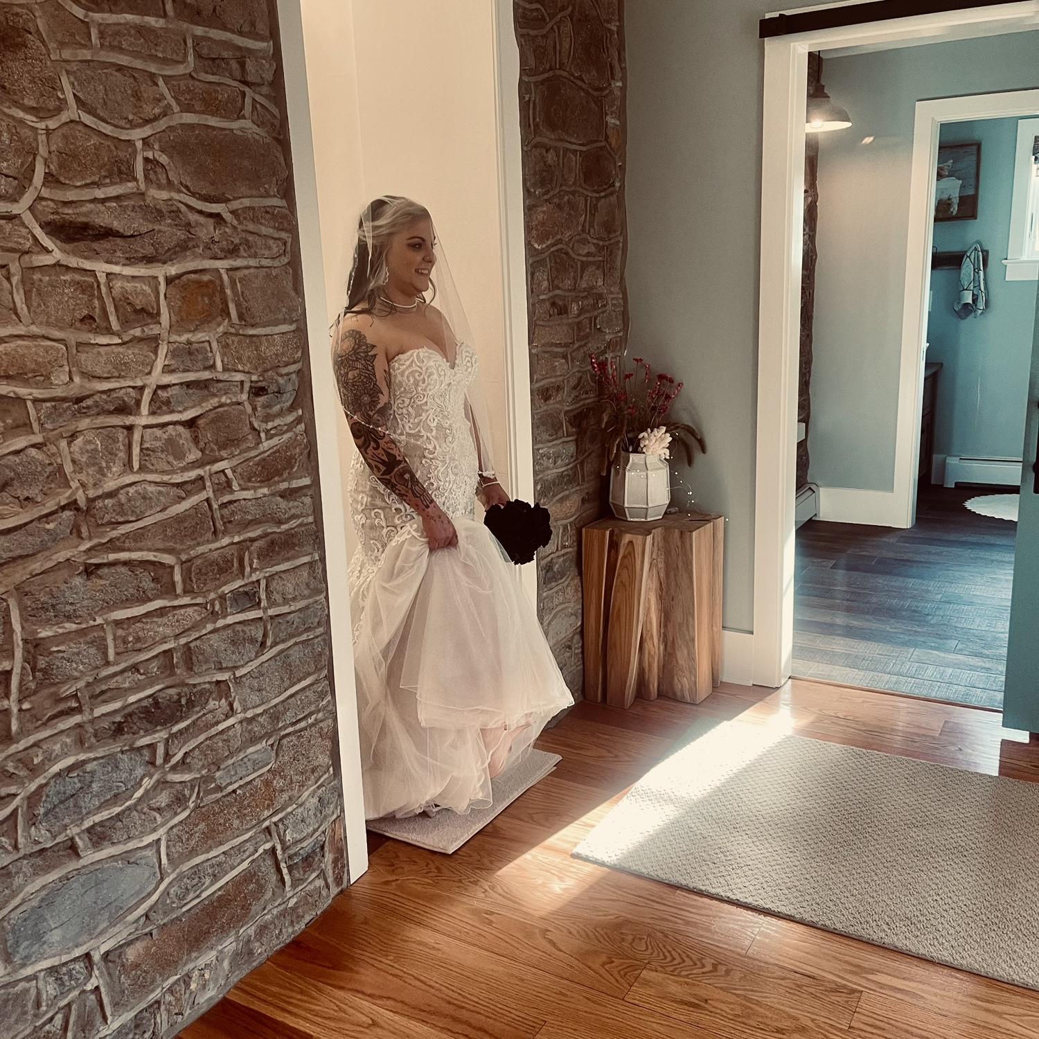 Bride walking down the aisle to the barn!